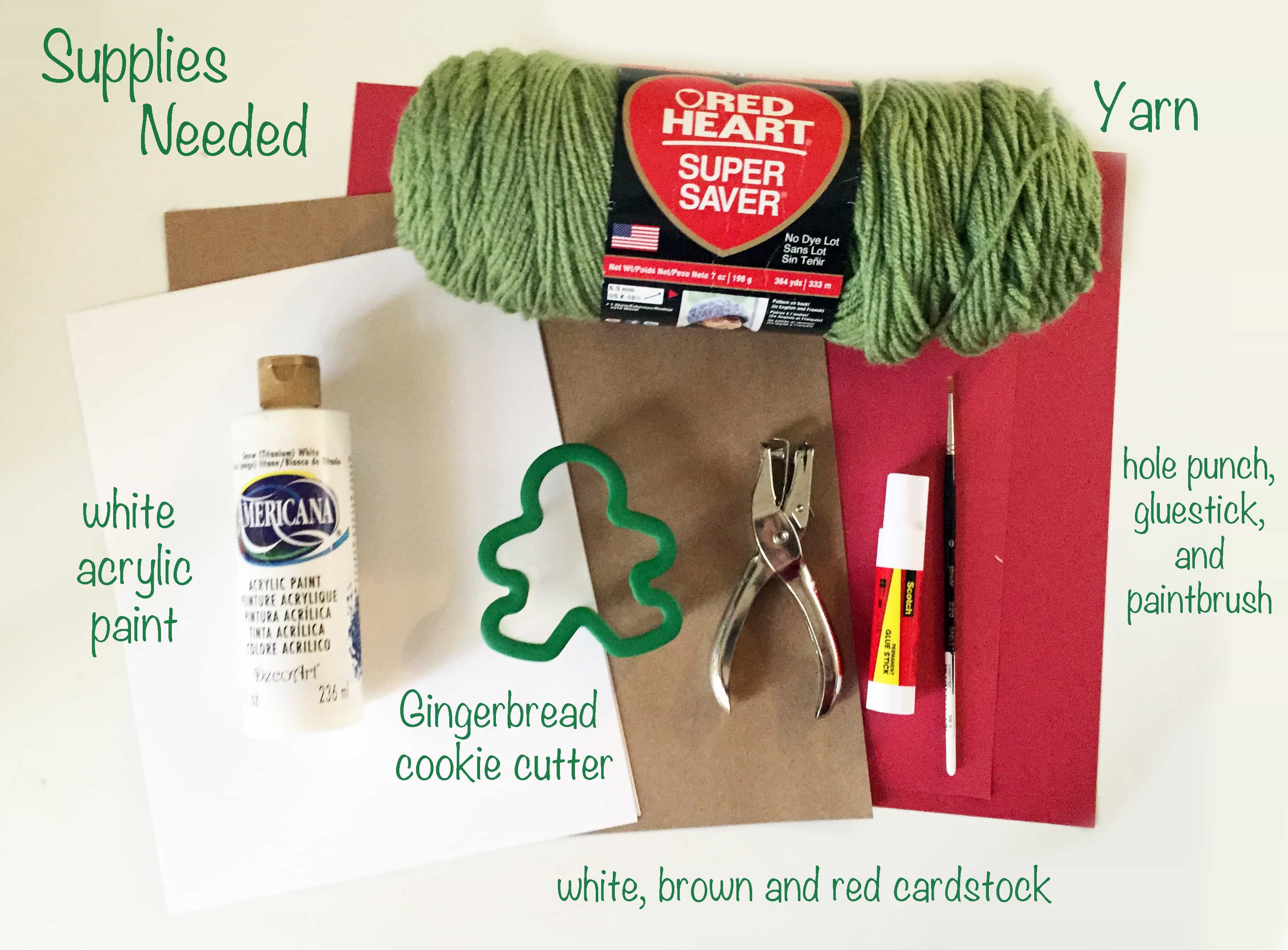 White, red and brown paper, white acrylic paint, hole punch, green yarn, gluestick and hole punch.