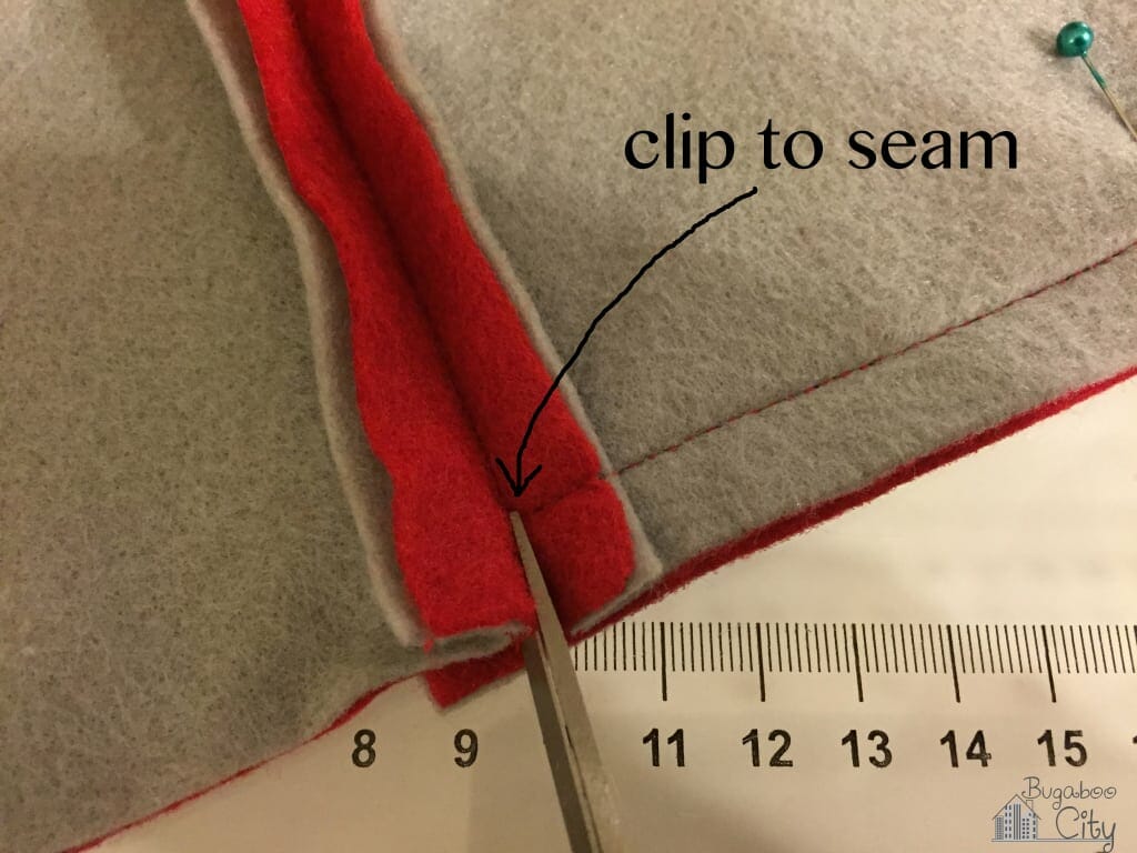 Clip to the seam before continuing to sew.