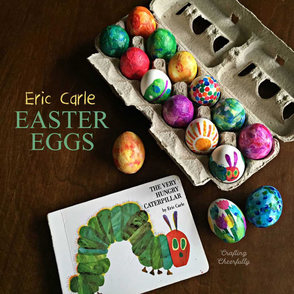A carton of eggs decorated with tissue paper sit next to the book The Very Hungry Caterpillar.