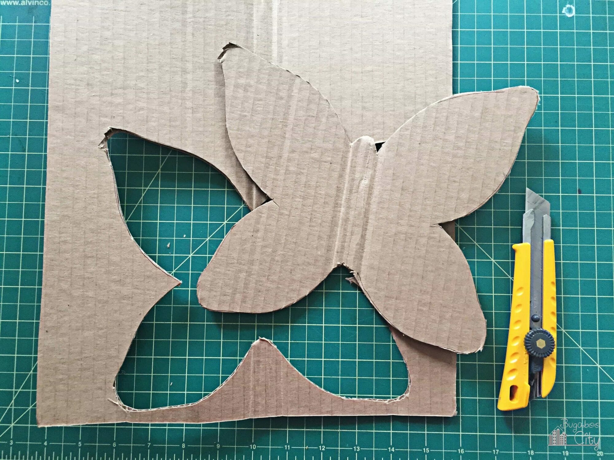Cardboard butterfly shape cut out.