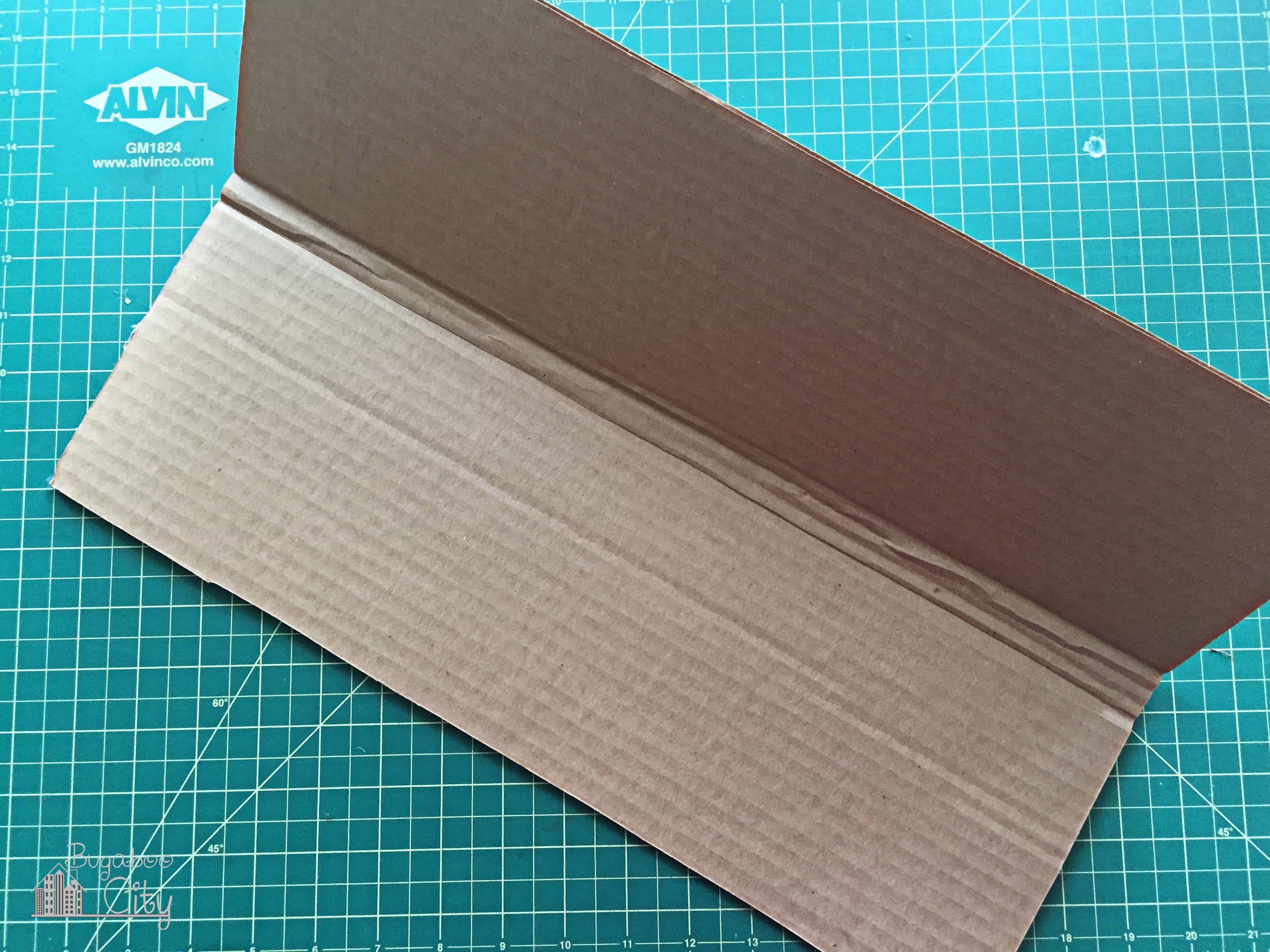 Piece of corrugated cardboard folded.