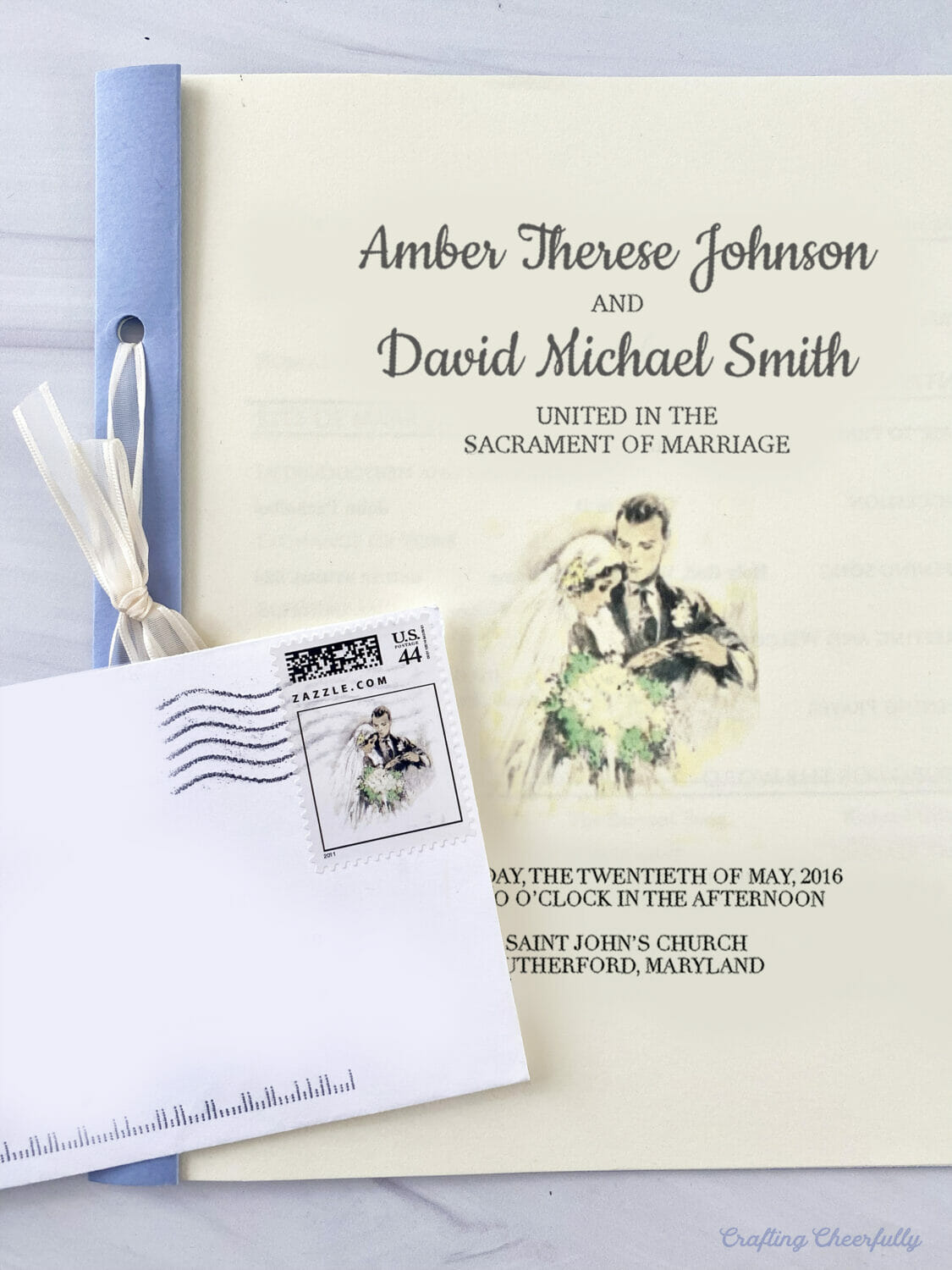 Ceremony program and envelope with wedding stamp; the image of a bride and groom on both match. 