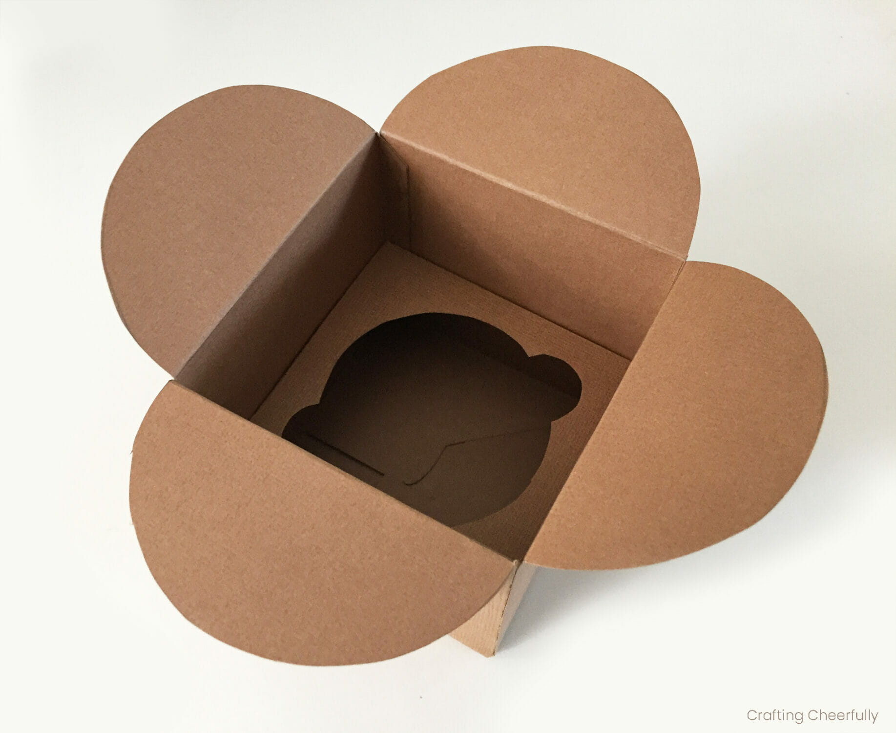 Cupcake box open at the top showing a cupcake holder inside.