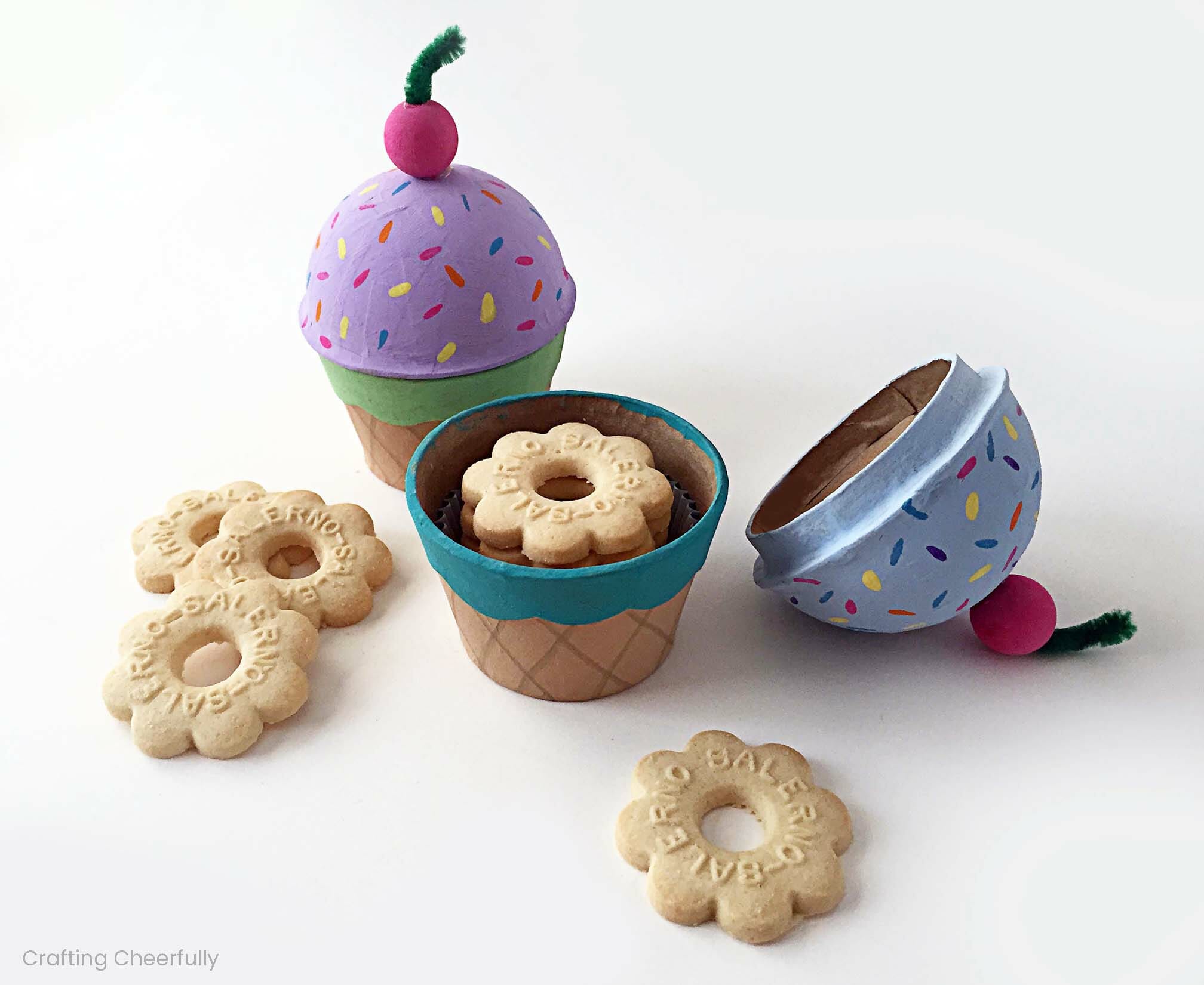 Ice cream cone treat boxes made from paper mache boxes filled with butter cookies.