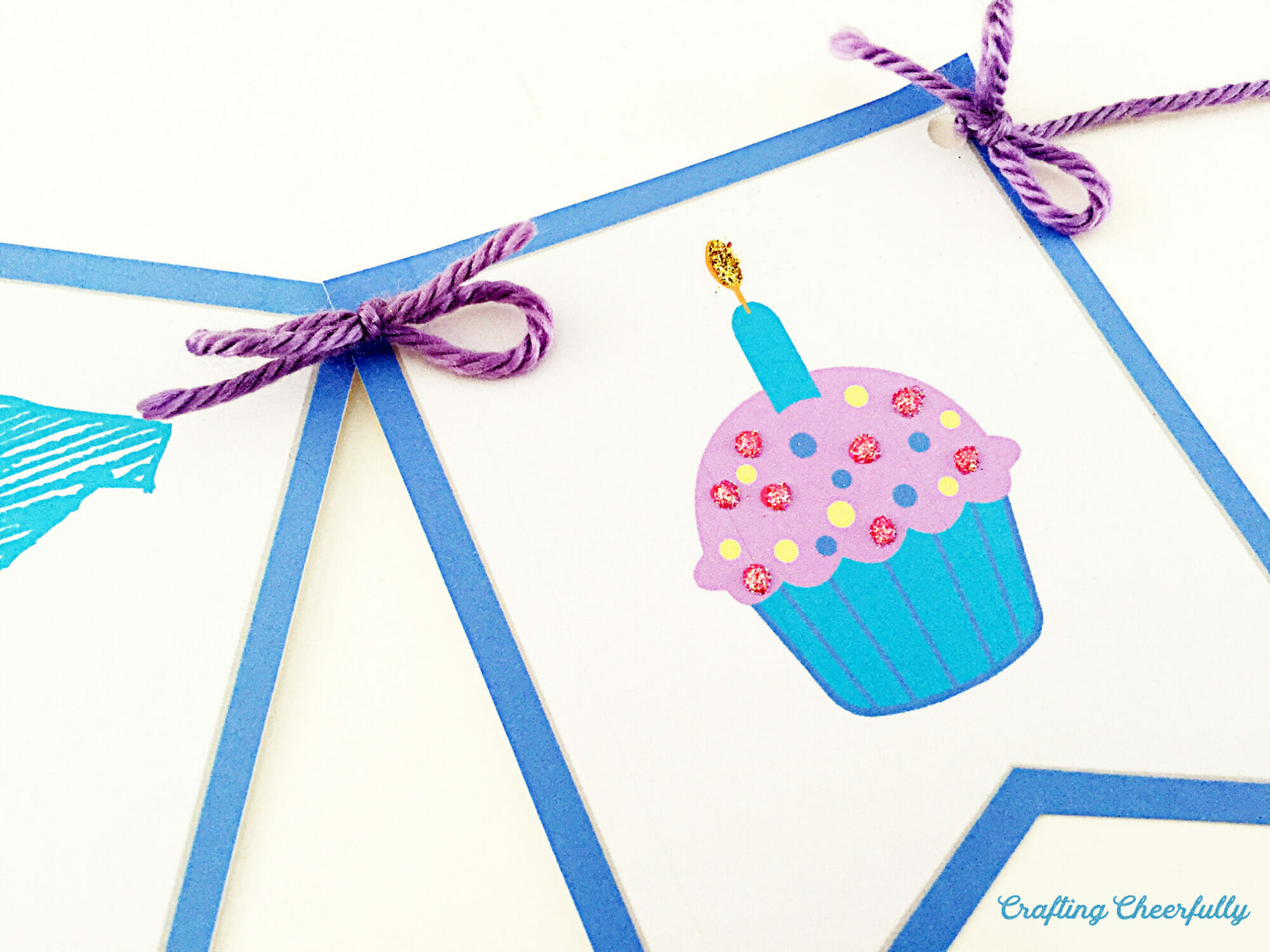 The cupcake pennant with glitter added to the candle flame and the sprinkles.