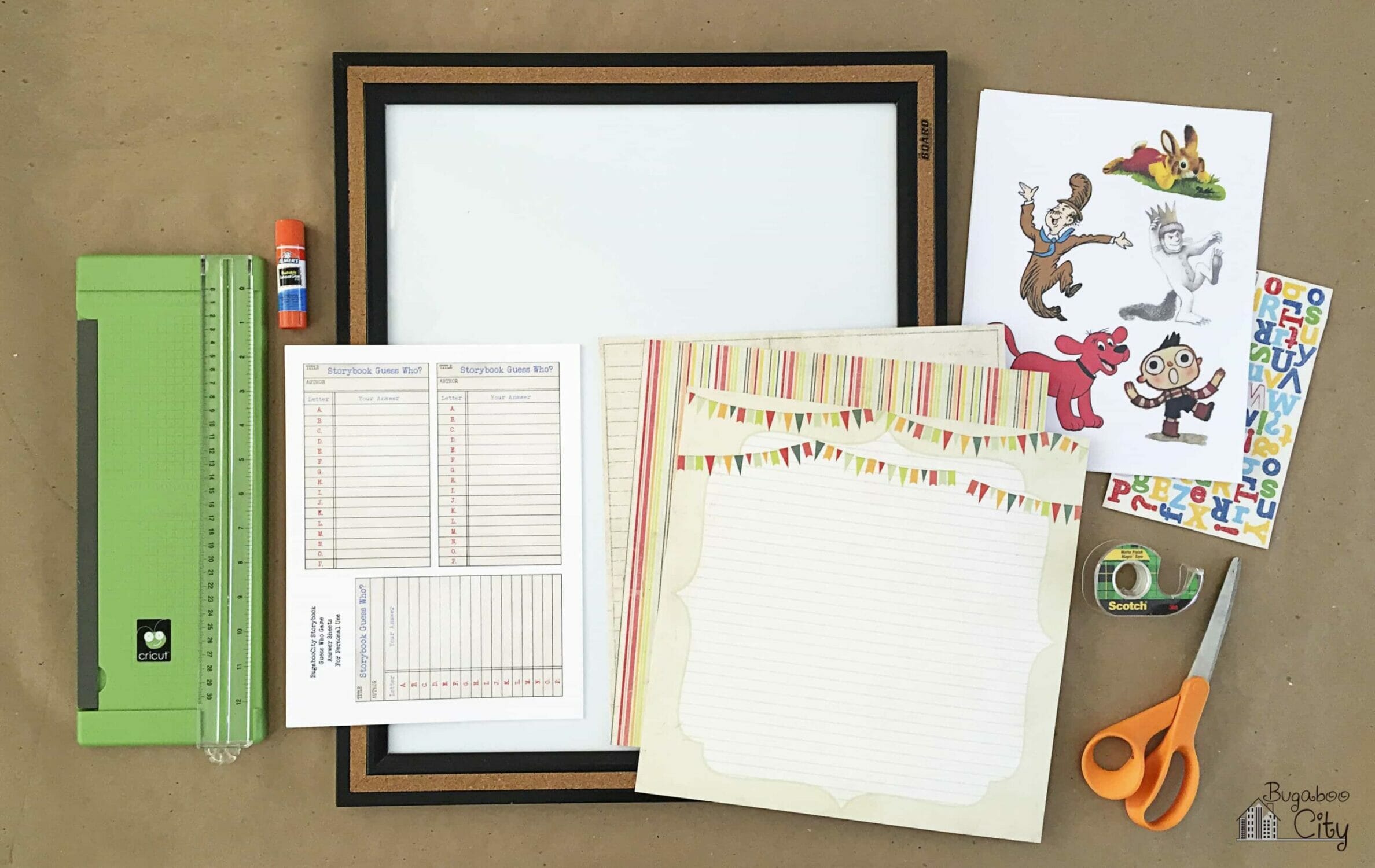 Dry erase board, scrapbook paper, paper trimmer, scissors and printed storybook characters.