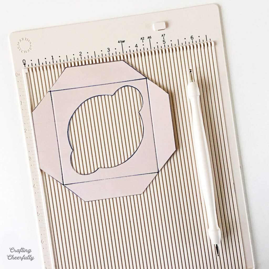 Greenhouse gift box printable on a scoring board.