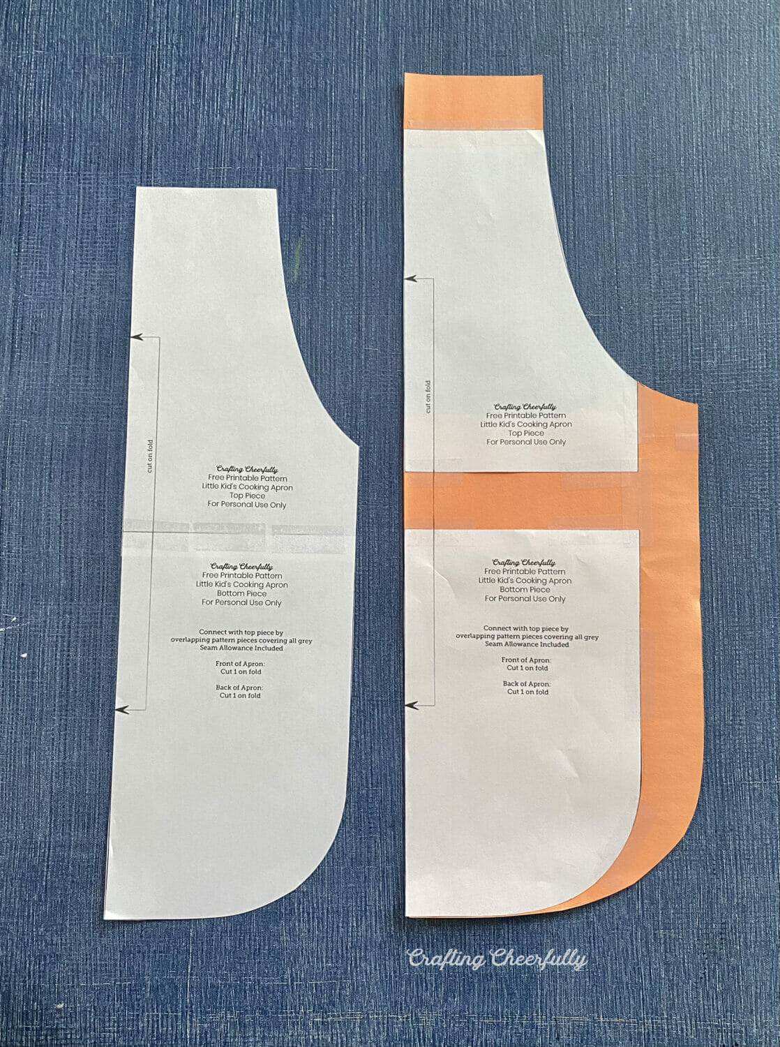 Two paper apron patterns in different sizes lay next to each other.