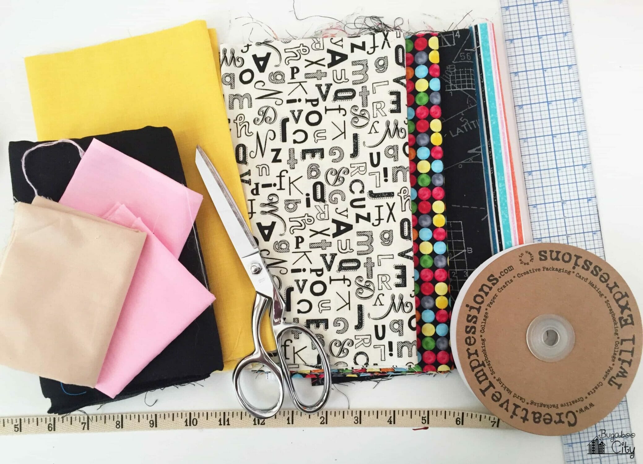 Colorful school-themed fabrics and ribbon that looks like a ruler.