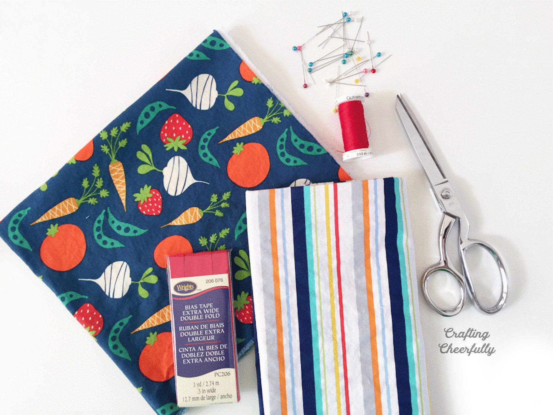 Fabric, bias tape, thread, pins and scissors.