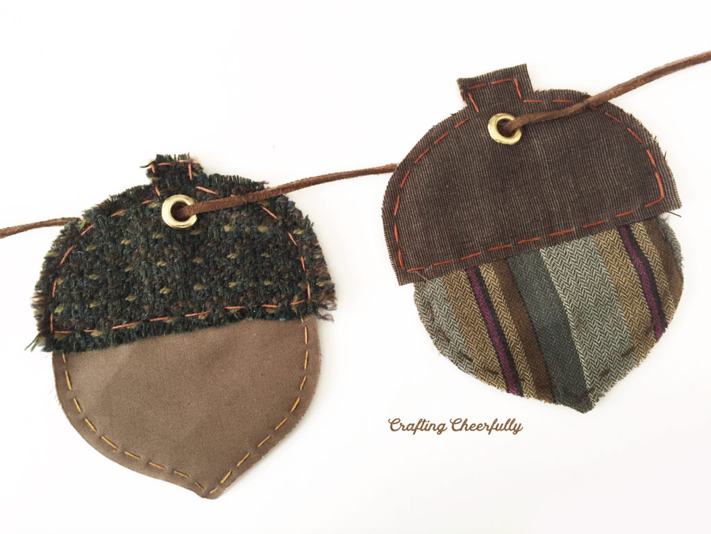 Acorns strung together using leather cording.