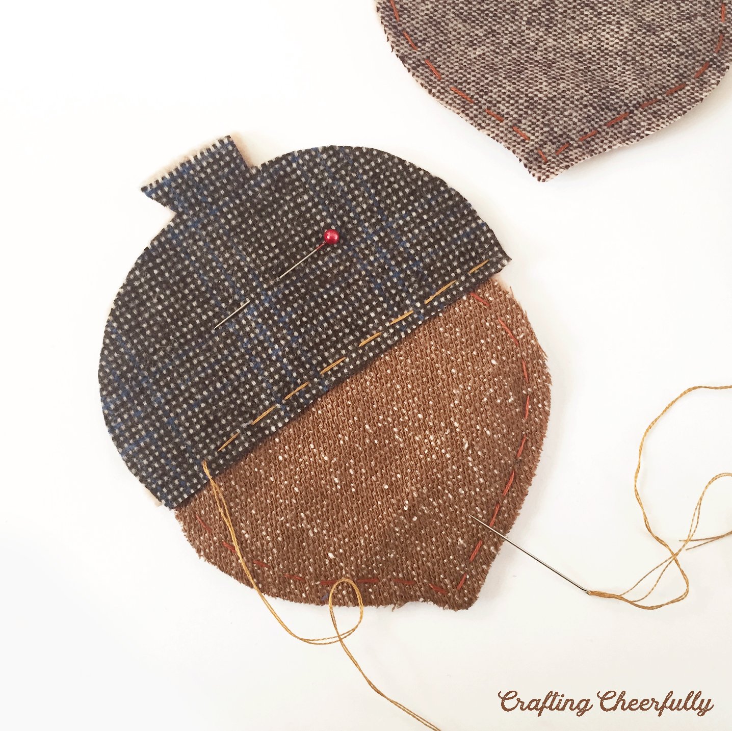 The top of the acorn is stitched using contrasting thread.