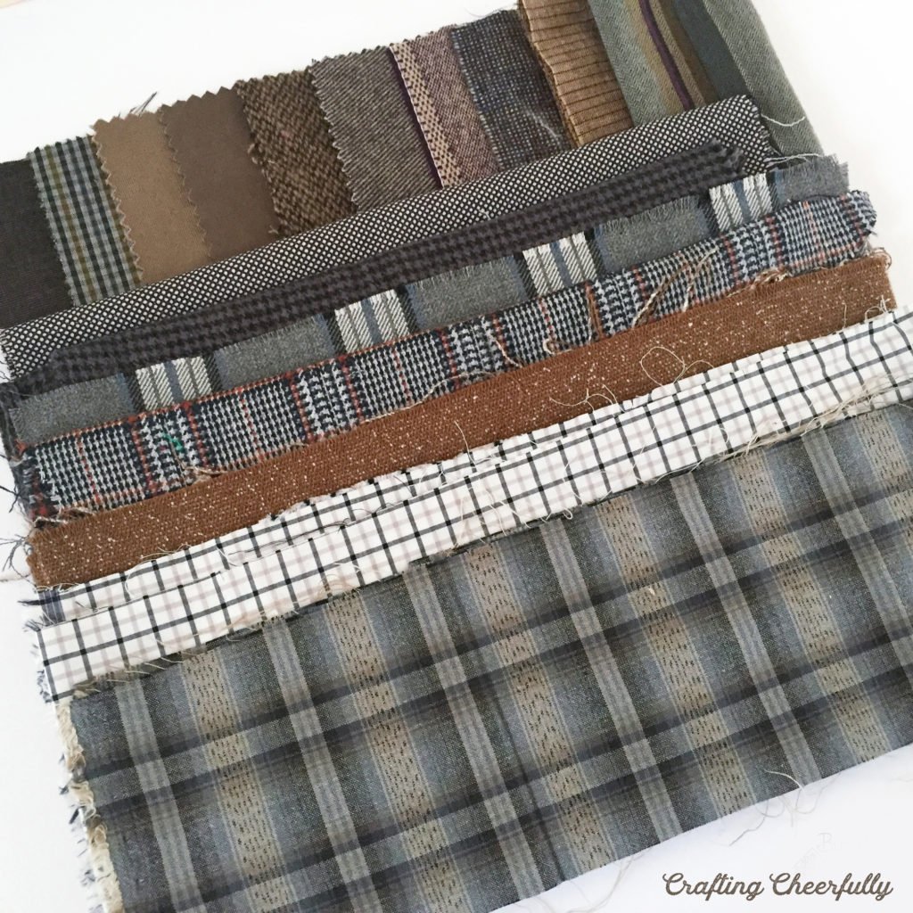 Scraps and swatches of plaid wool fabrics.