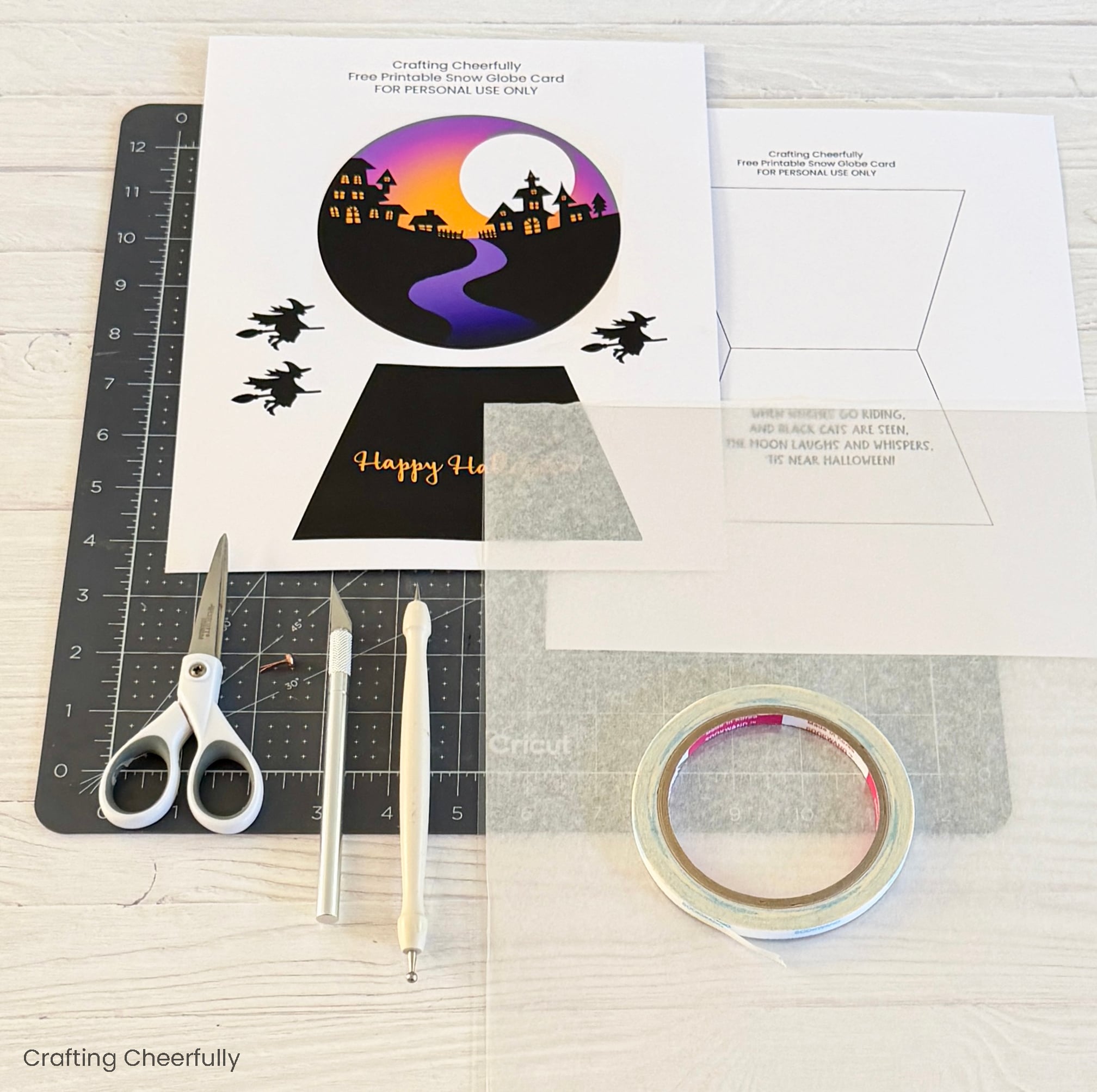 Supplies including printable, scissors, double-sided tape, self-healing mat.
