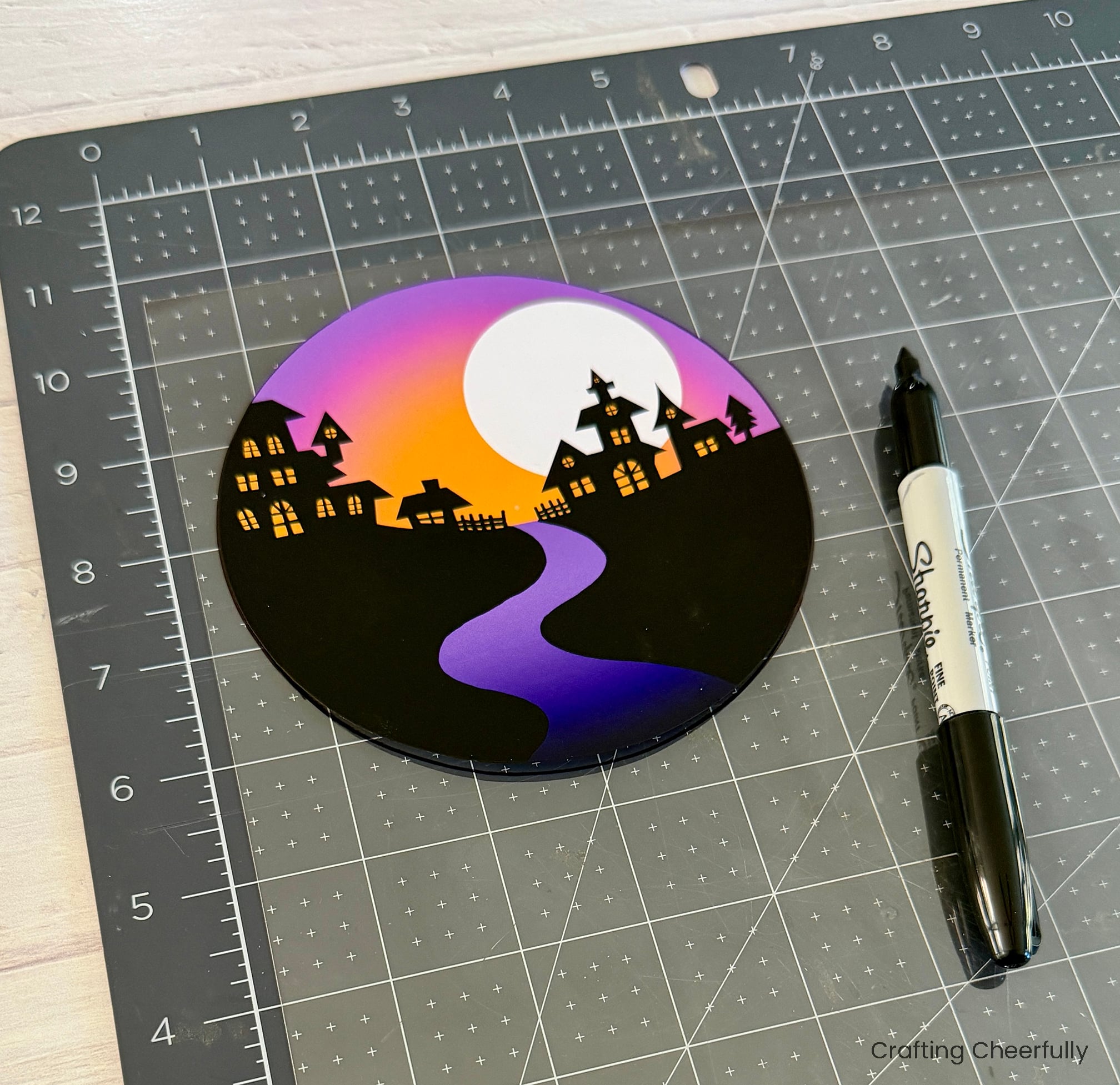 The circle of the globe is traced onto a piece of clear acetate.