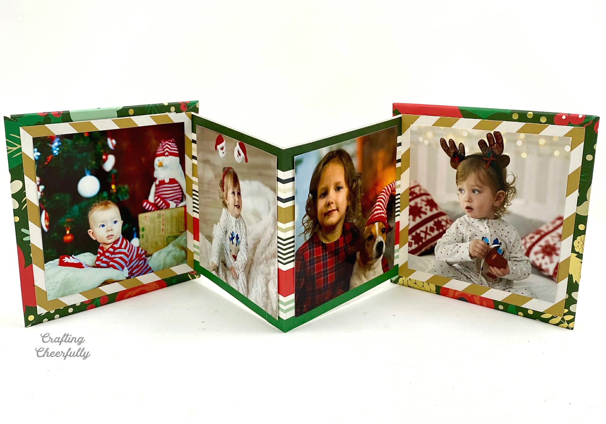 Paper accordion-folded album displaying photos of kids at the holidays.