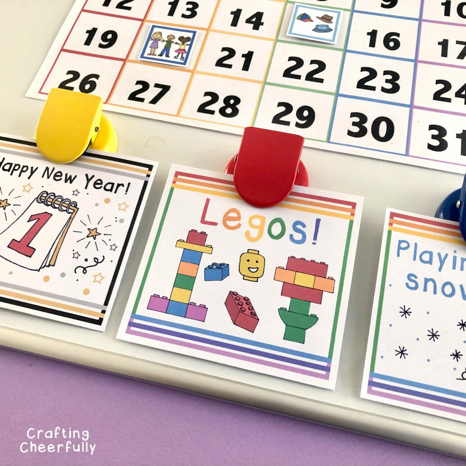 Activity cards clipped to kid's calendar.
