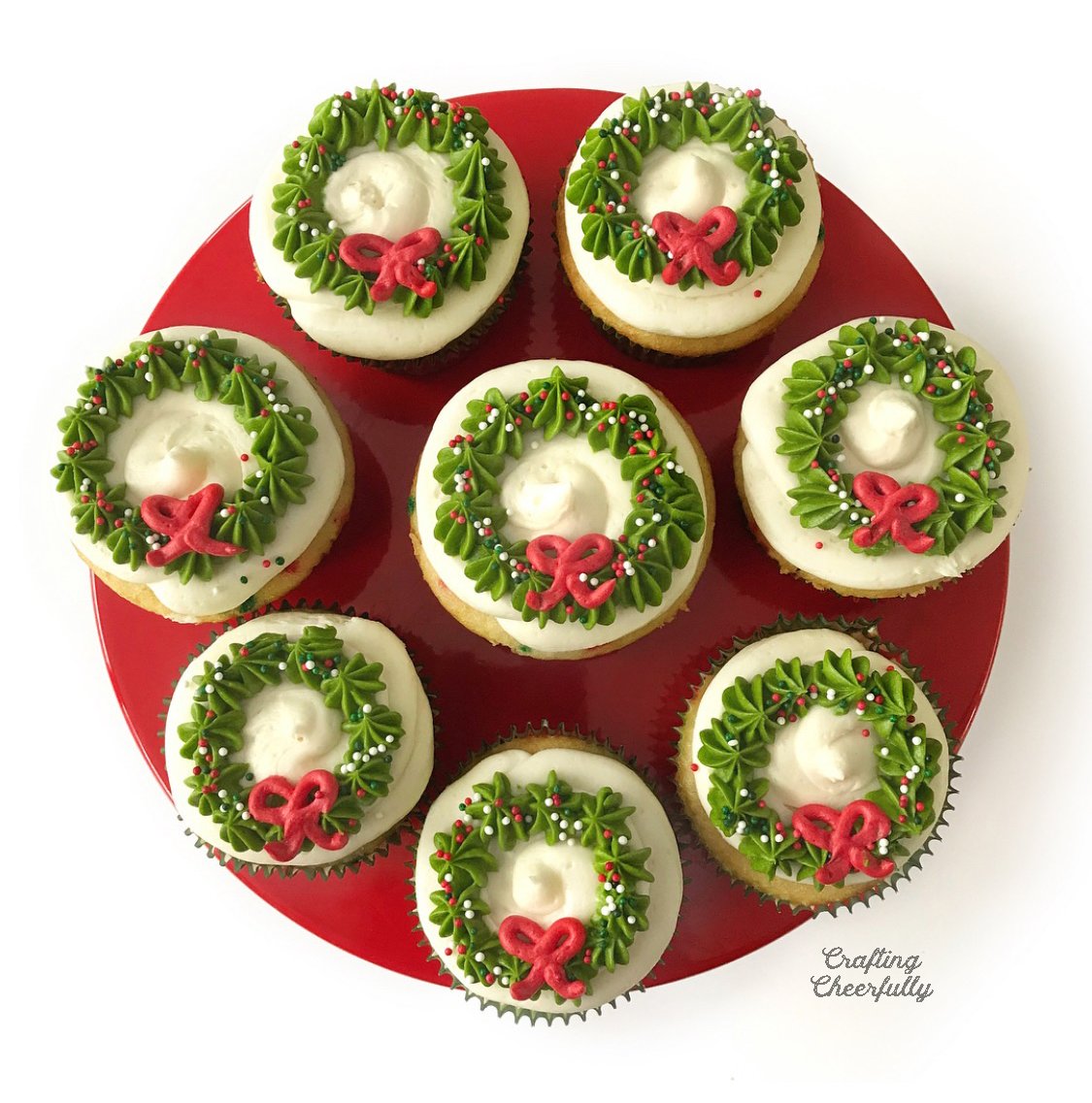 Cupcakes with frosting wreath designs on the top.