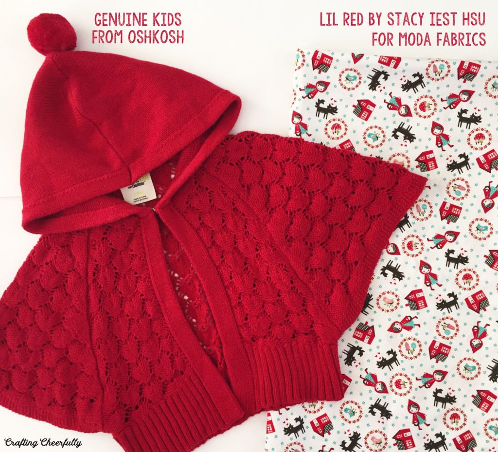 Little Red Riding Hood baby dress fabric Lil Red by Stacy Iest Hsu lays next to a little red cape.