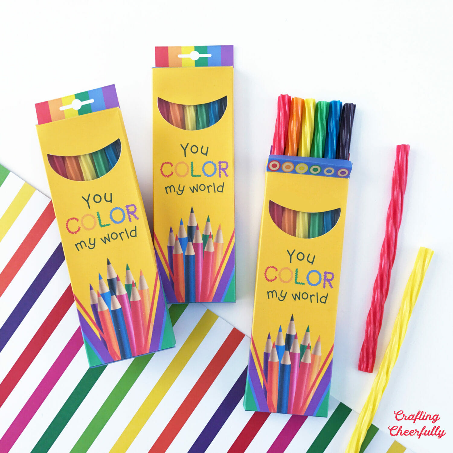 Colored pencil paper treat boxes hold colorful pieces of licorice!