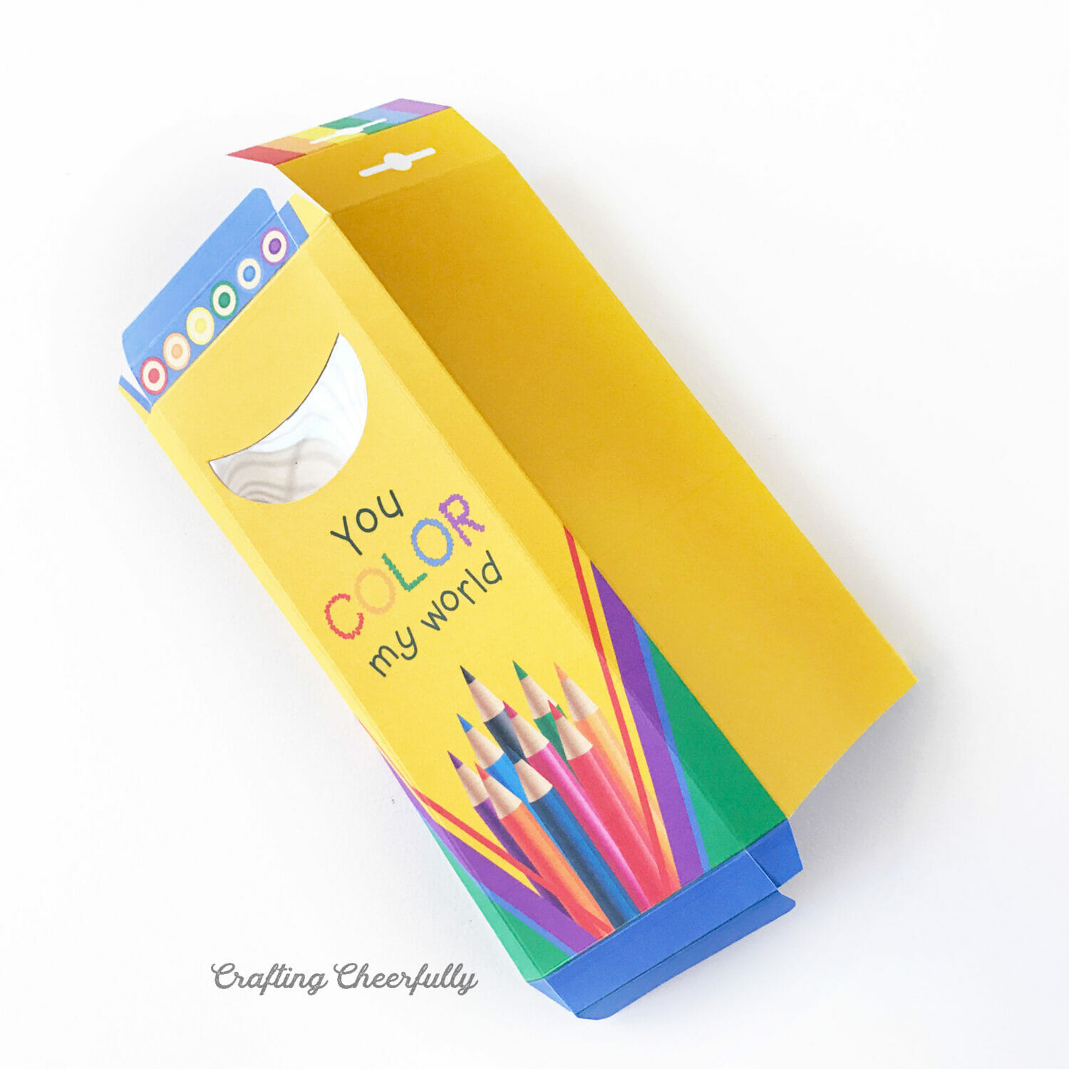 Colored pencil treat box gently folded along the scored lines.