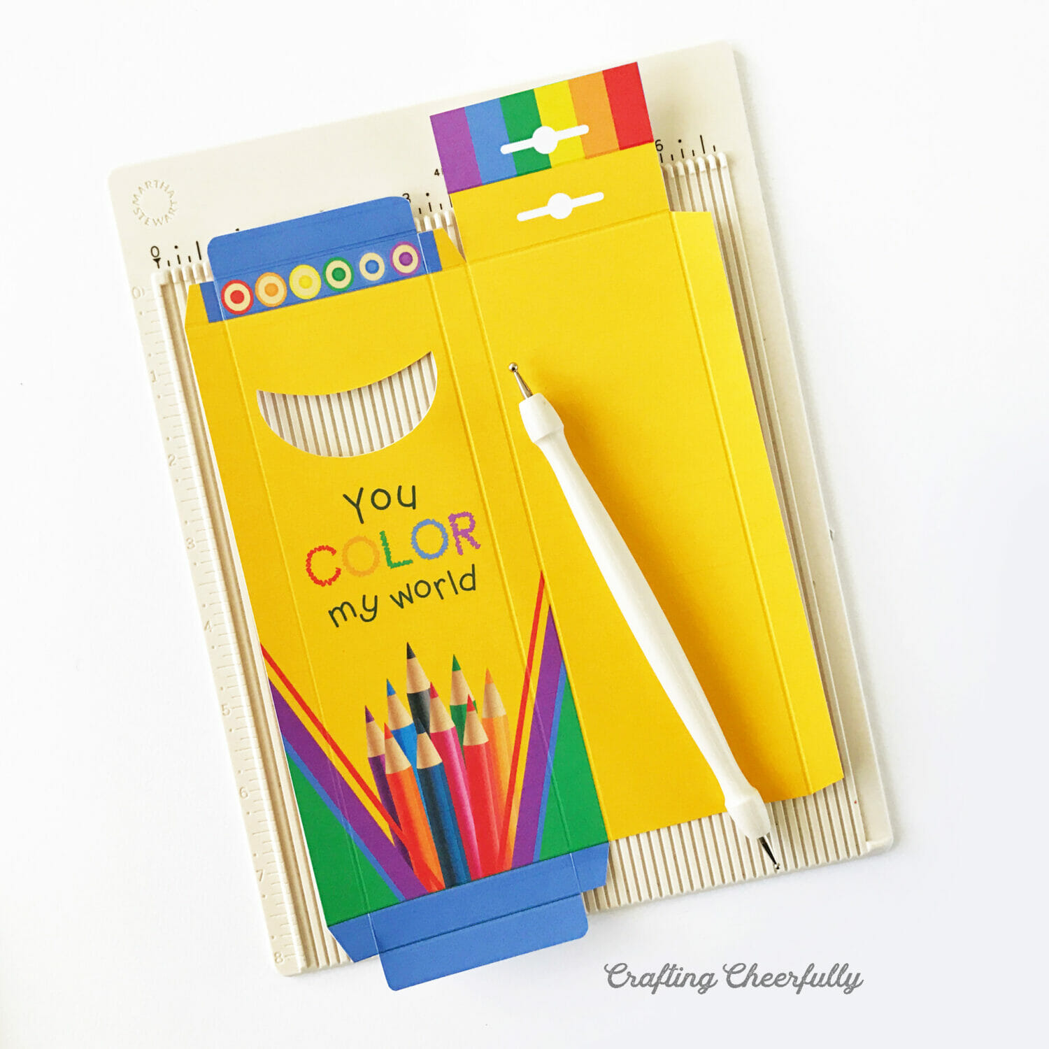 Colored pencil treat box scored on a scoring board.