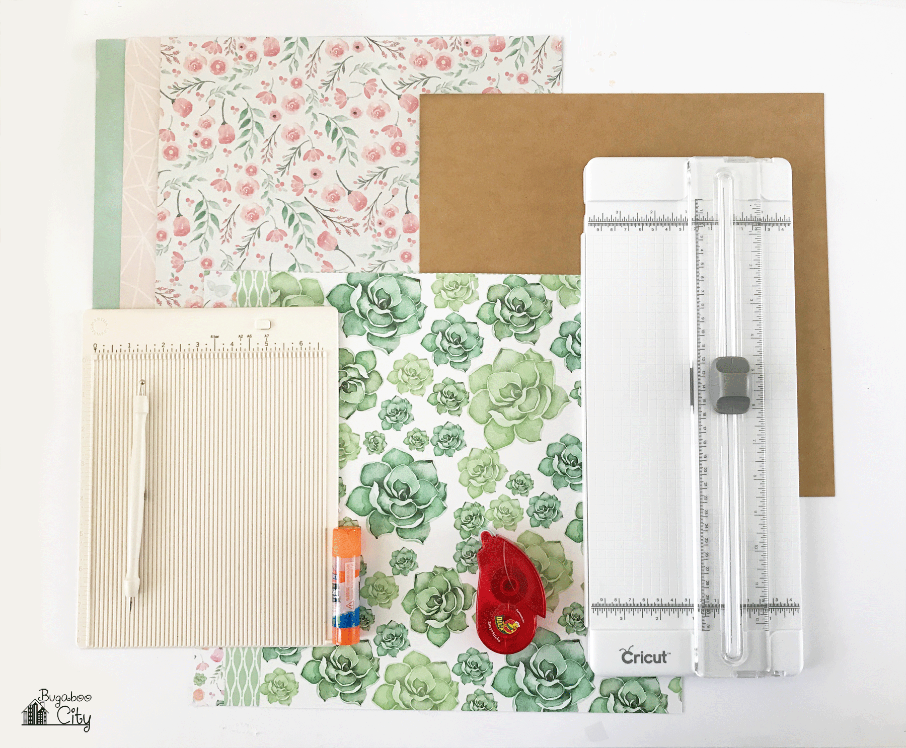 Supplies needed like a paper trimmer, paper, chip board, tape runner, glue stick, scoring board.