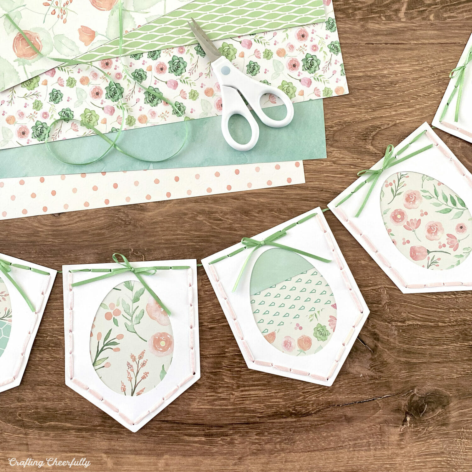 Paper Easter egg banner made with floral paper and ribbon.