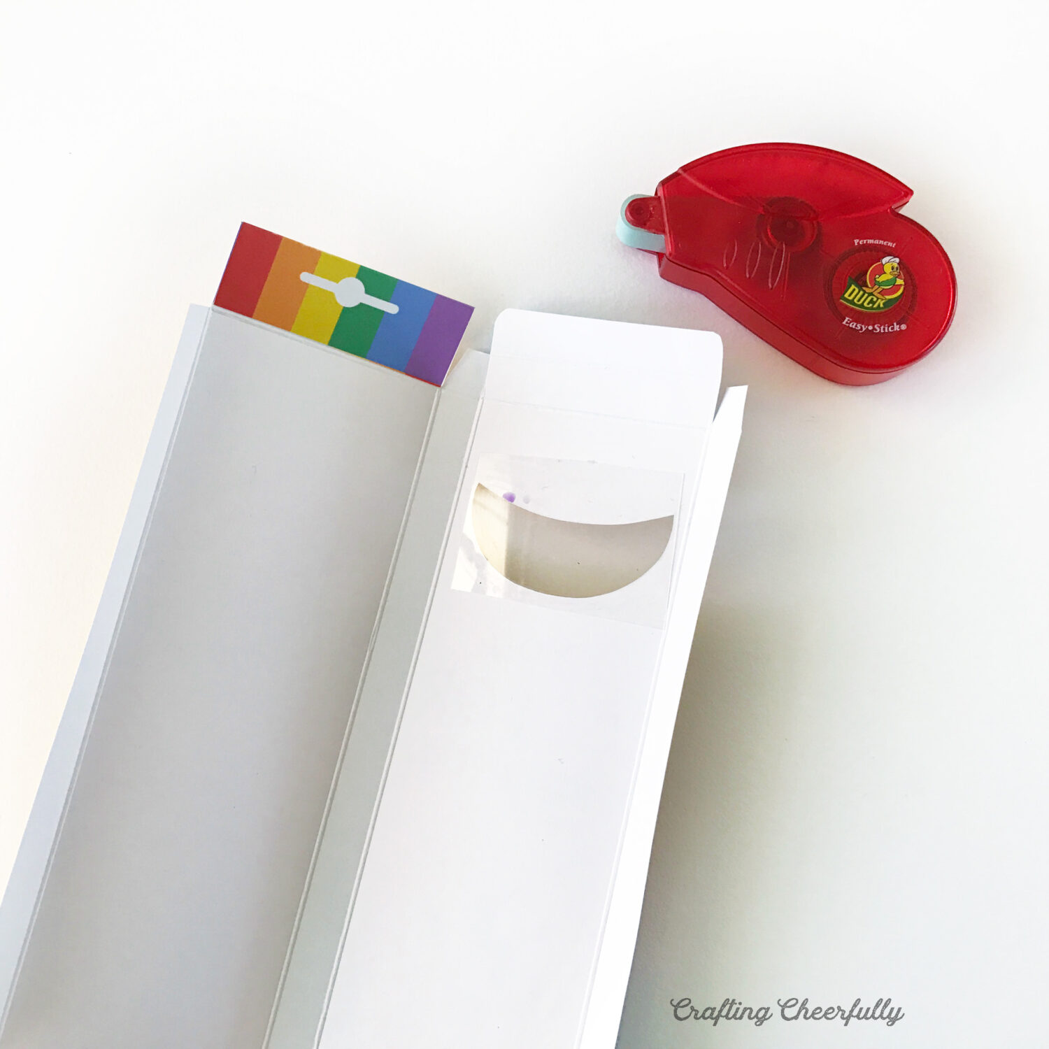 Treat box lays open next to a red tape runner.