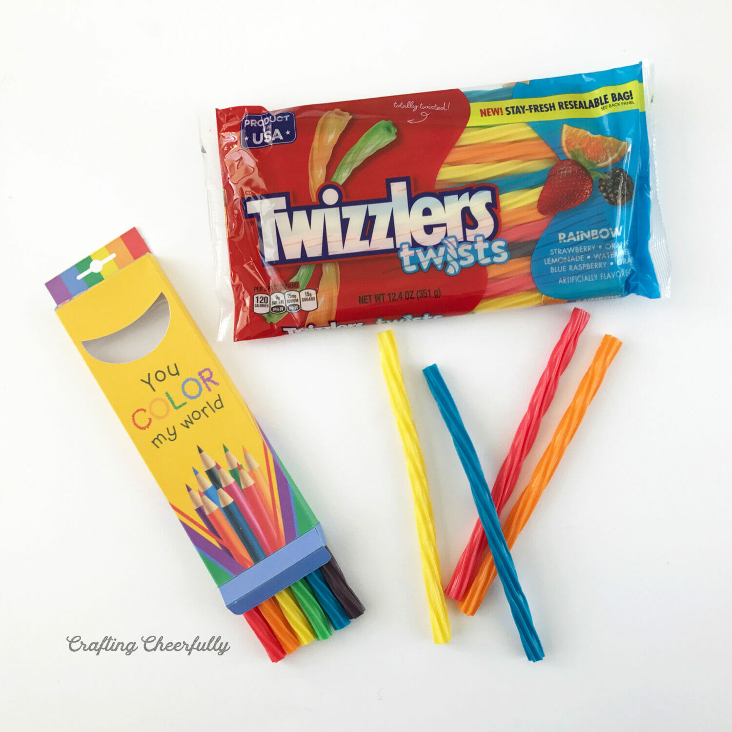 Bag of Twizzlers Twists lays next to a treat box.