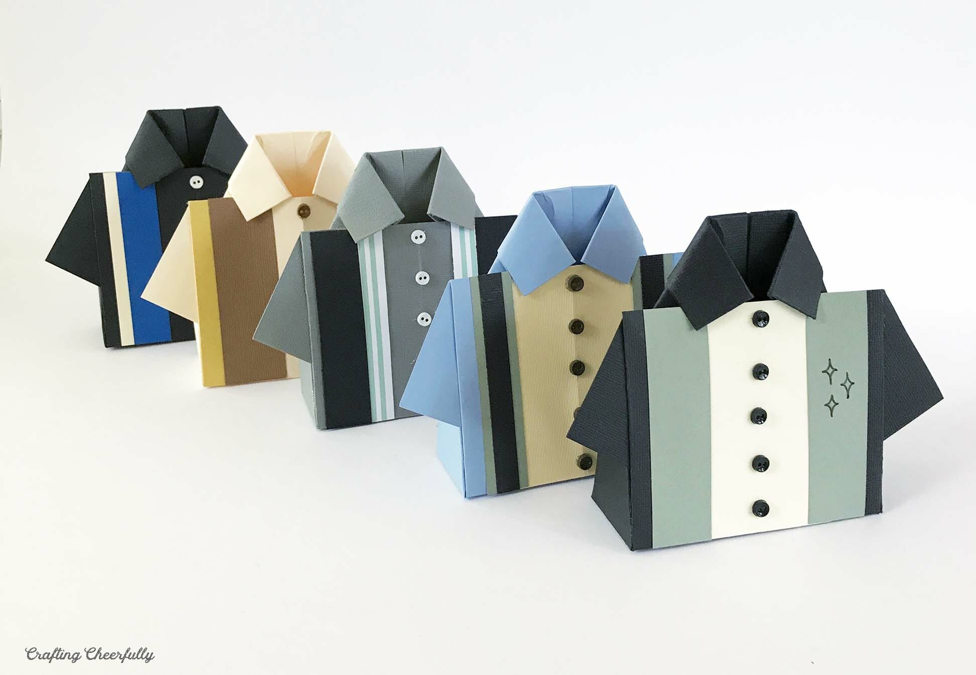 Five paper bowling shirt boxes stand in a row.