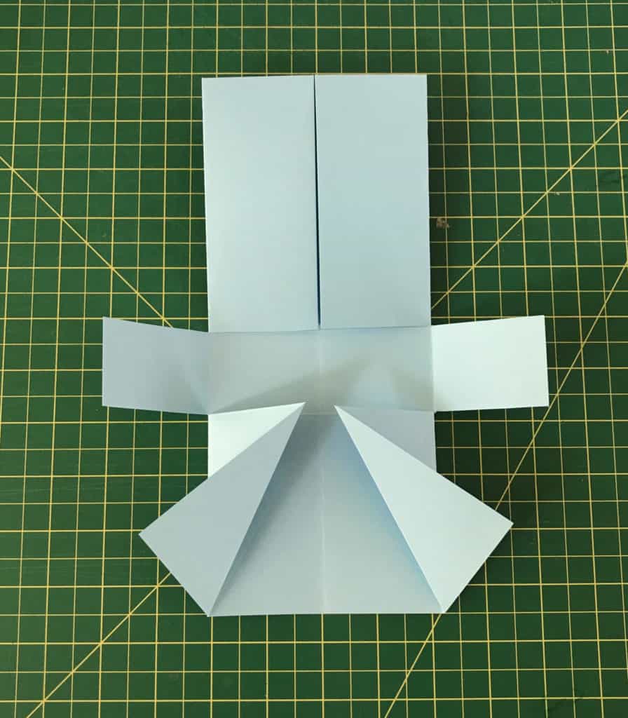 The paper is cut in the center to the center line.