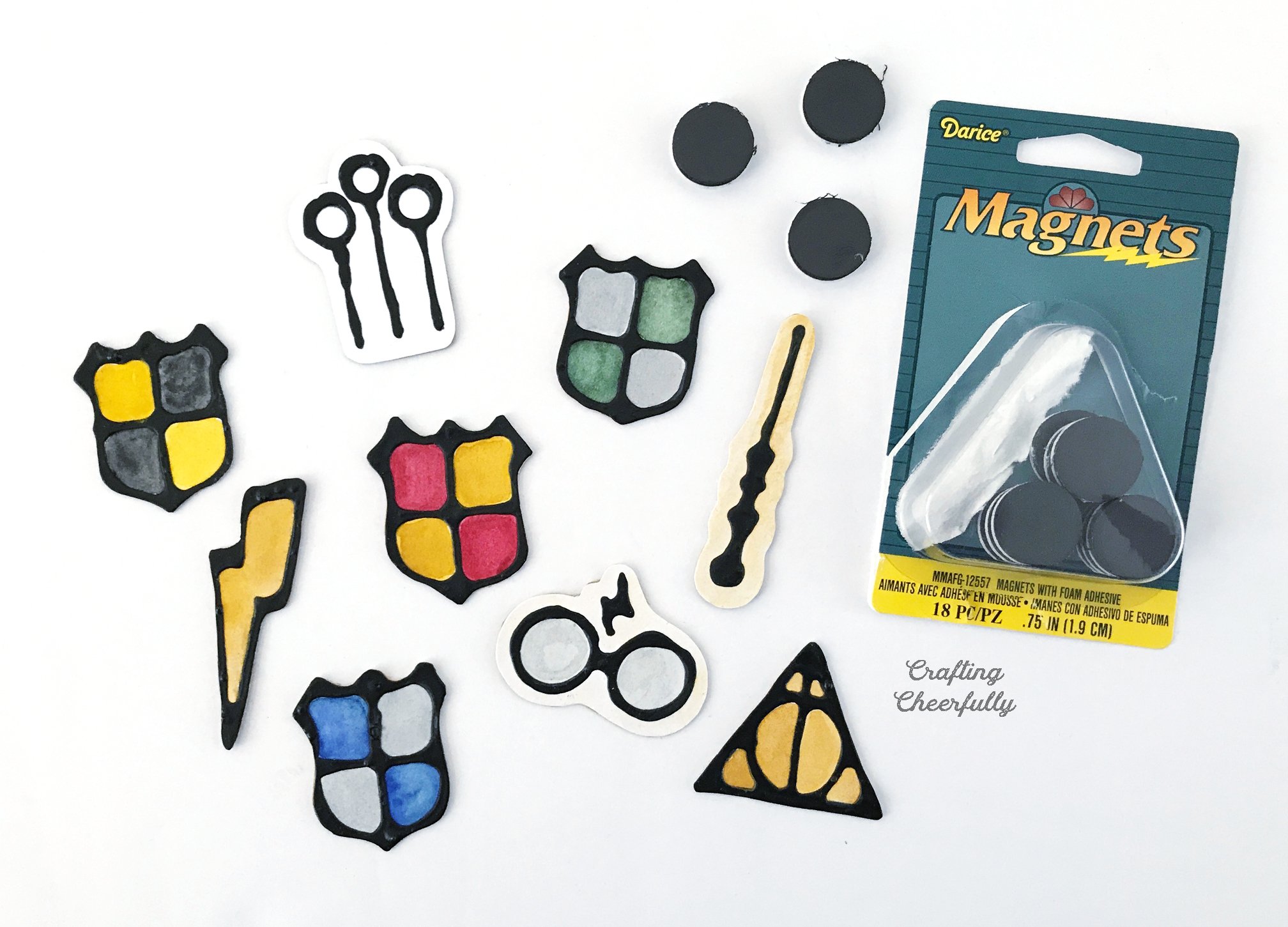 Harry Potter magnets lay next to a package of magnets.