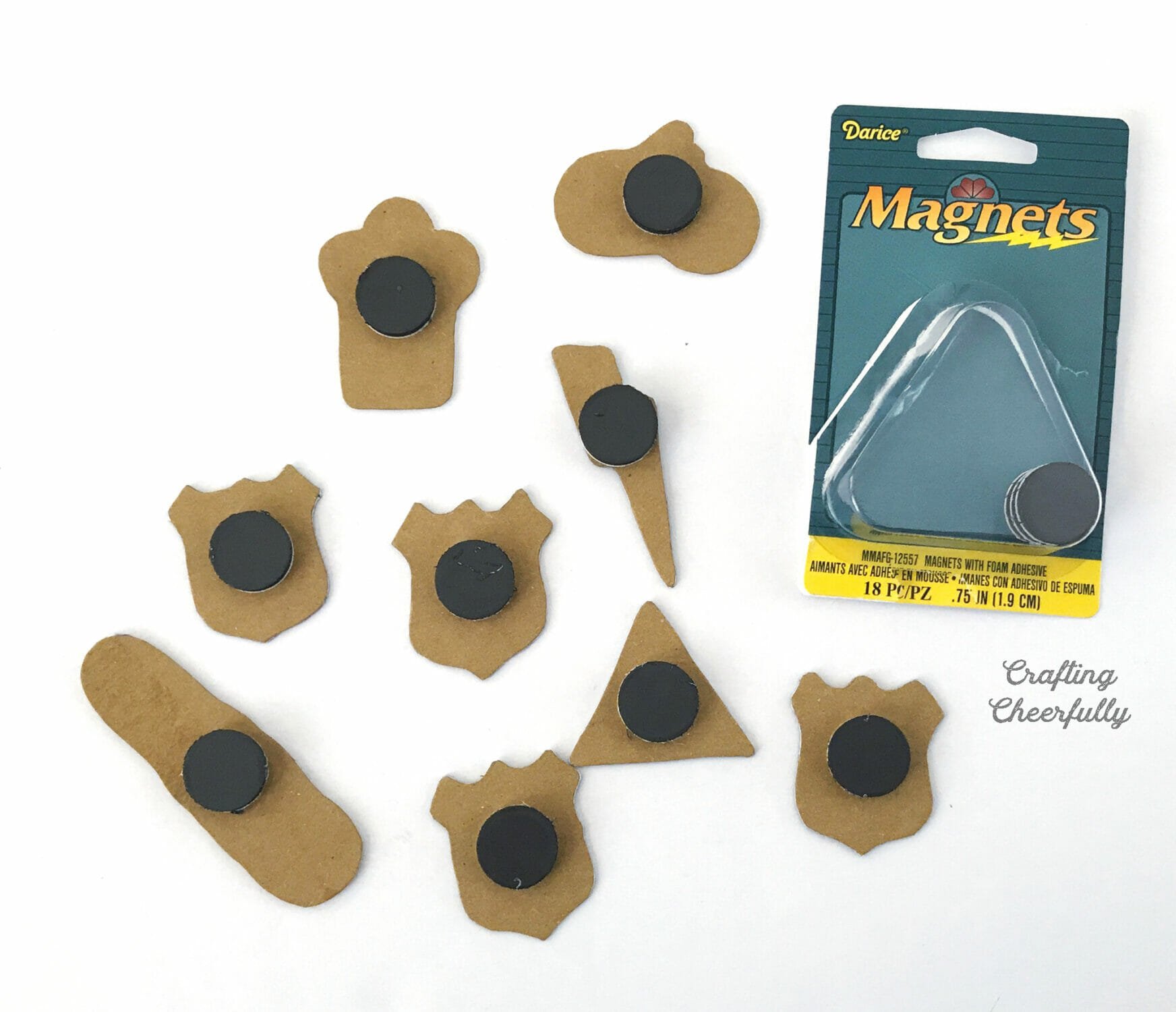 Adhesive magnets are placed on the back of the chipboard magnets.