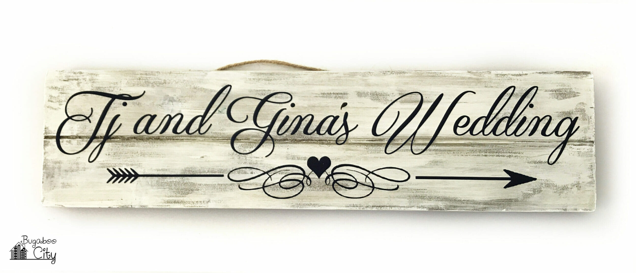 Personalized wedding sign made from a white distressed board and black vinyl.