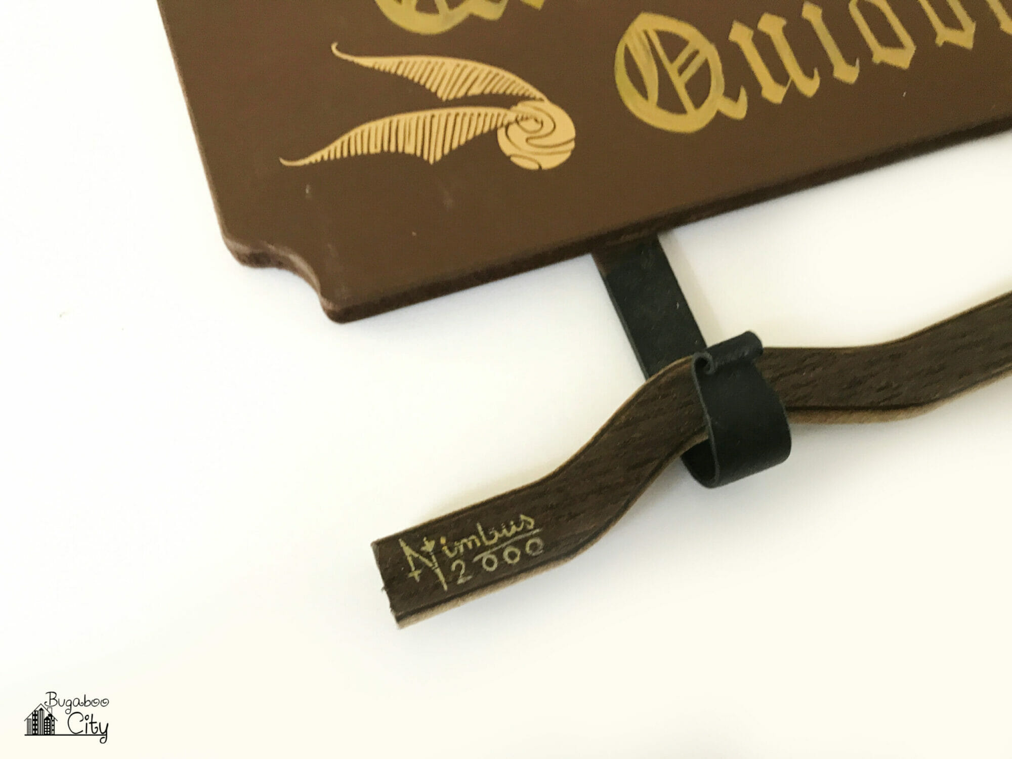 Nimbus 2000 is added to the end of the broomstick with a gold gel pen.