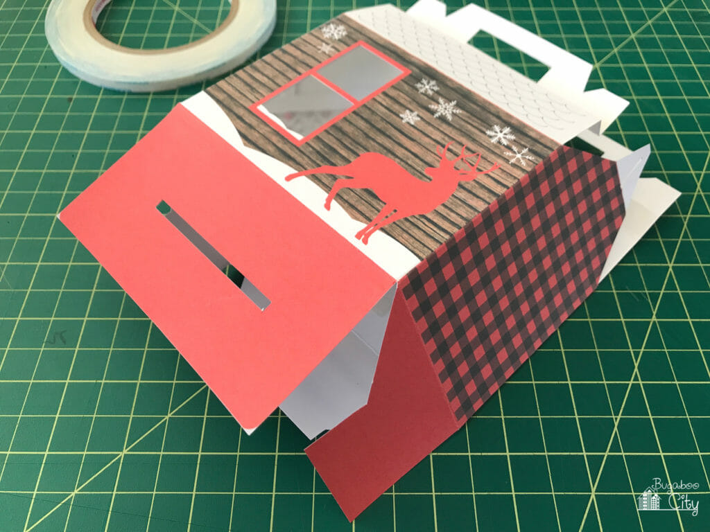 The cozy cabin treat box is formed by attaching the tabs.