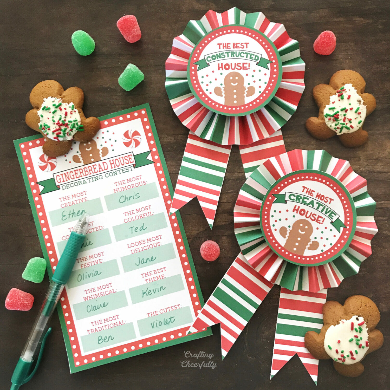 Gingerbread House Award ribbons lay on a table with gingerbread cookies.