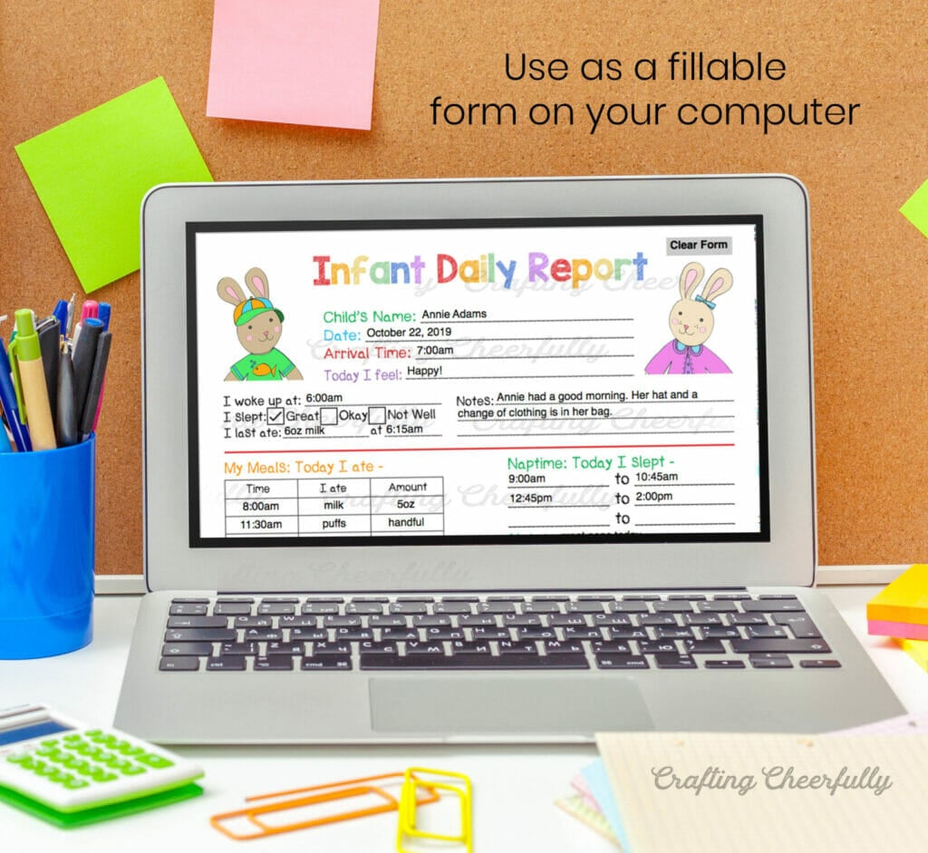 Laptop with the infant daily report on the screen in front of a bulletin board with colorful post-it notes.