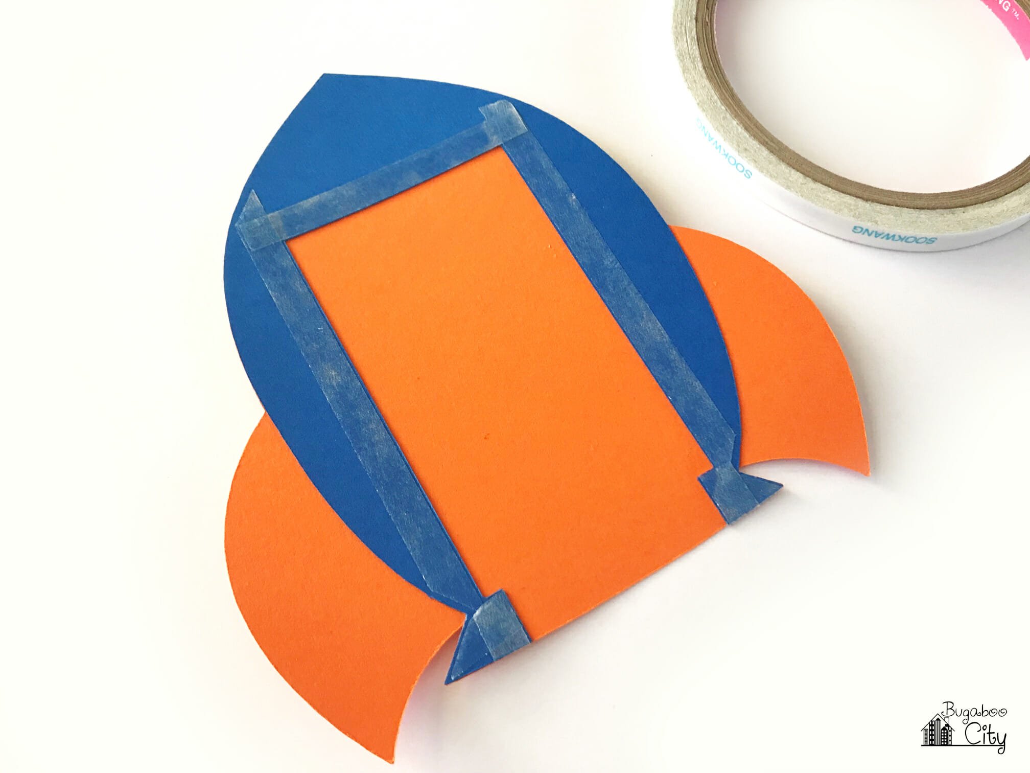 Adhesive covers the rocket ship card.