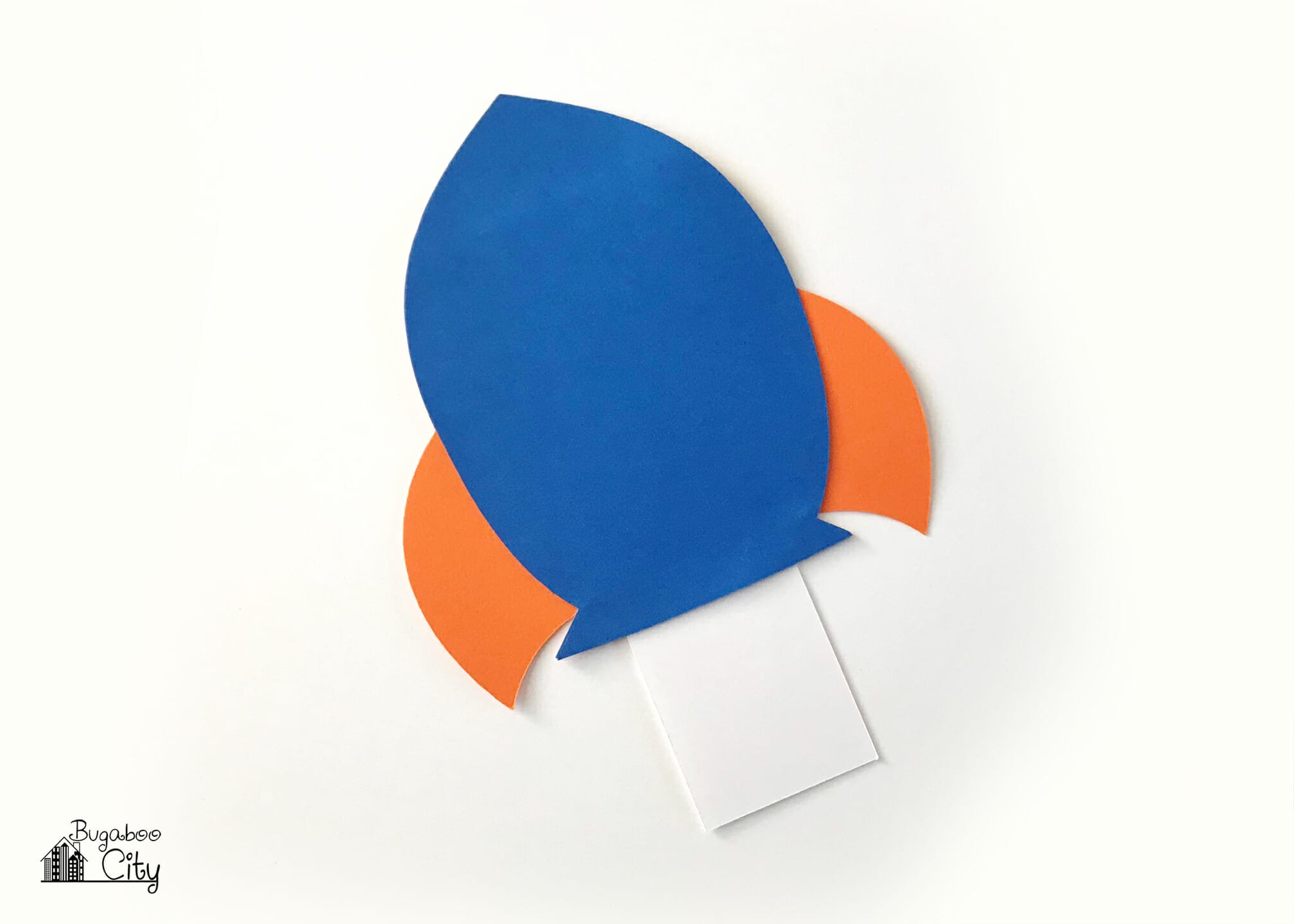 The top layer of the rocket ship card is applied to the bottom layers, this covers the insert.