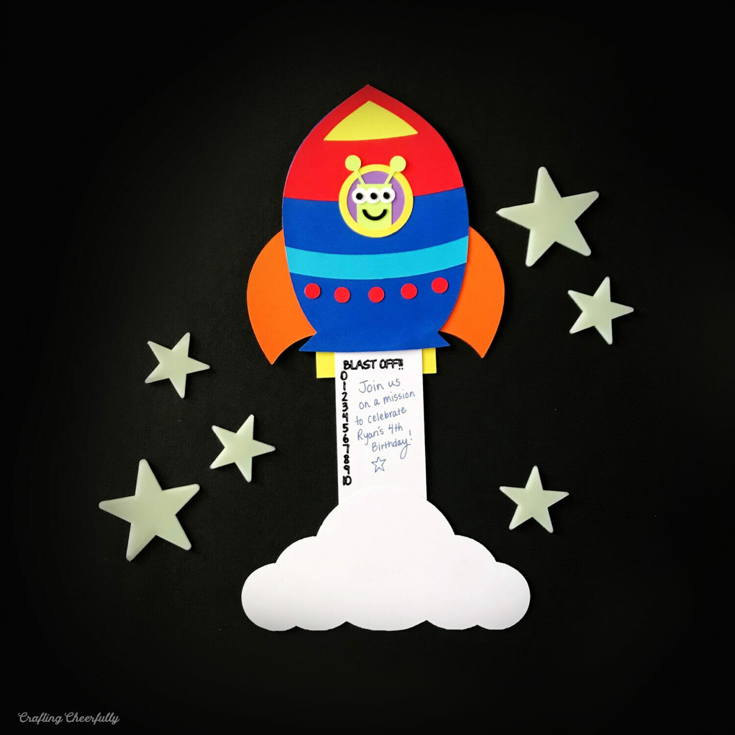 Paper rocket ship card slid open to reveal numbers that countdown from 10 to 0.