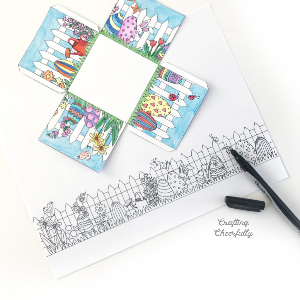 Colored Easter basket printable lays above a drawing.