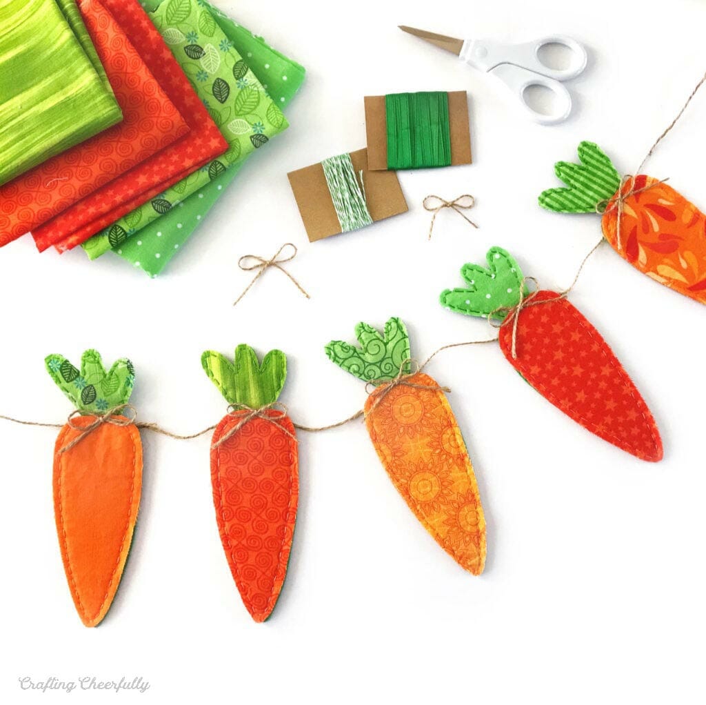 DIY Carrot Banner made from orange and green fabric scraps.