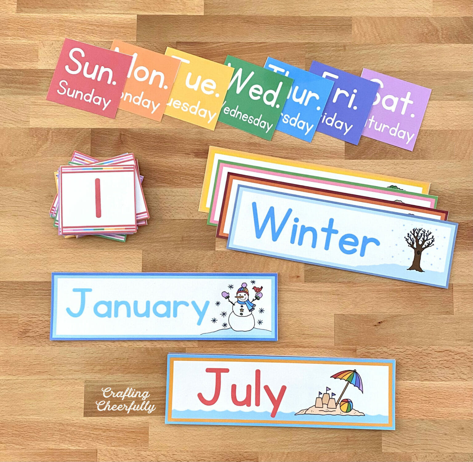 Pocket chart printables cut out and laid out on a table.