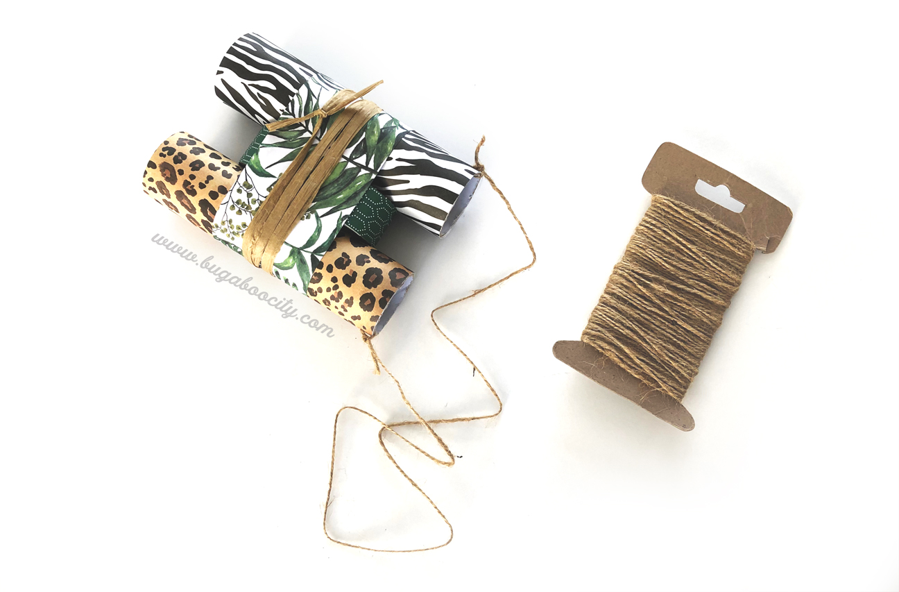 Brown twine is used to tie a hanging strap to the binoculars.