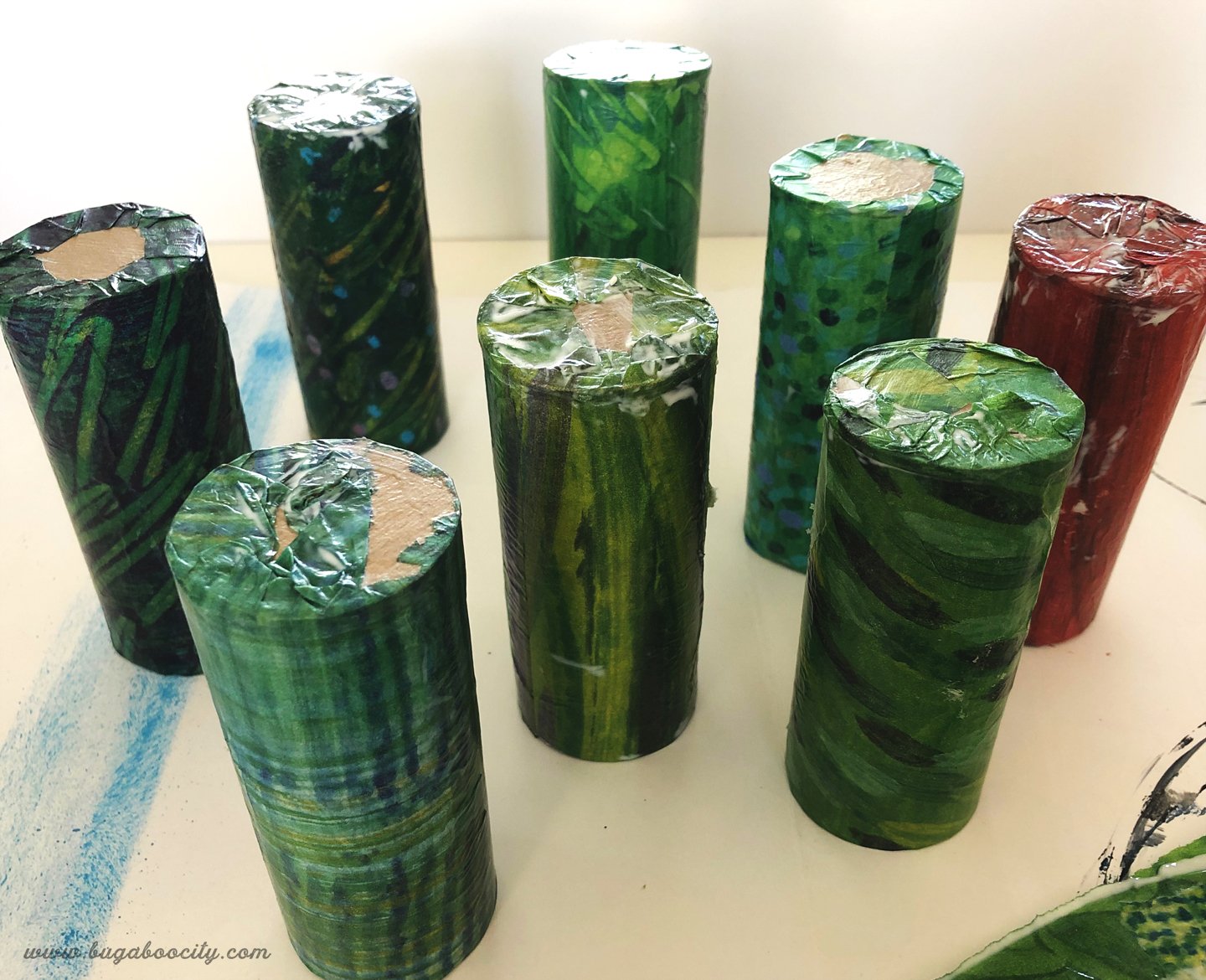 Green tissue paper mod modged to cardboard tubes.