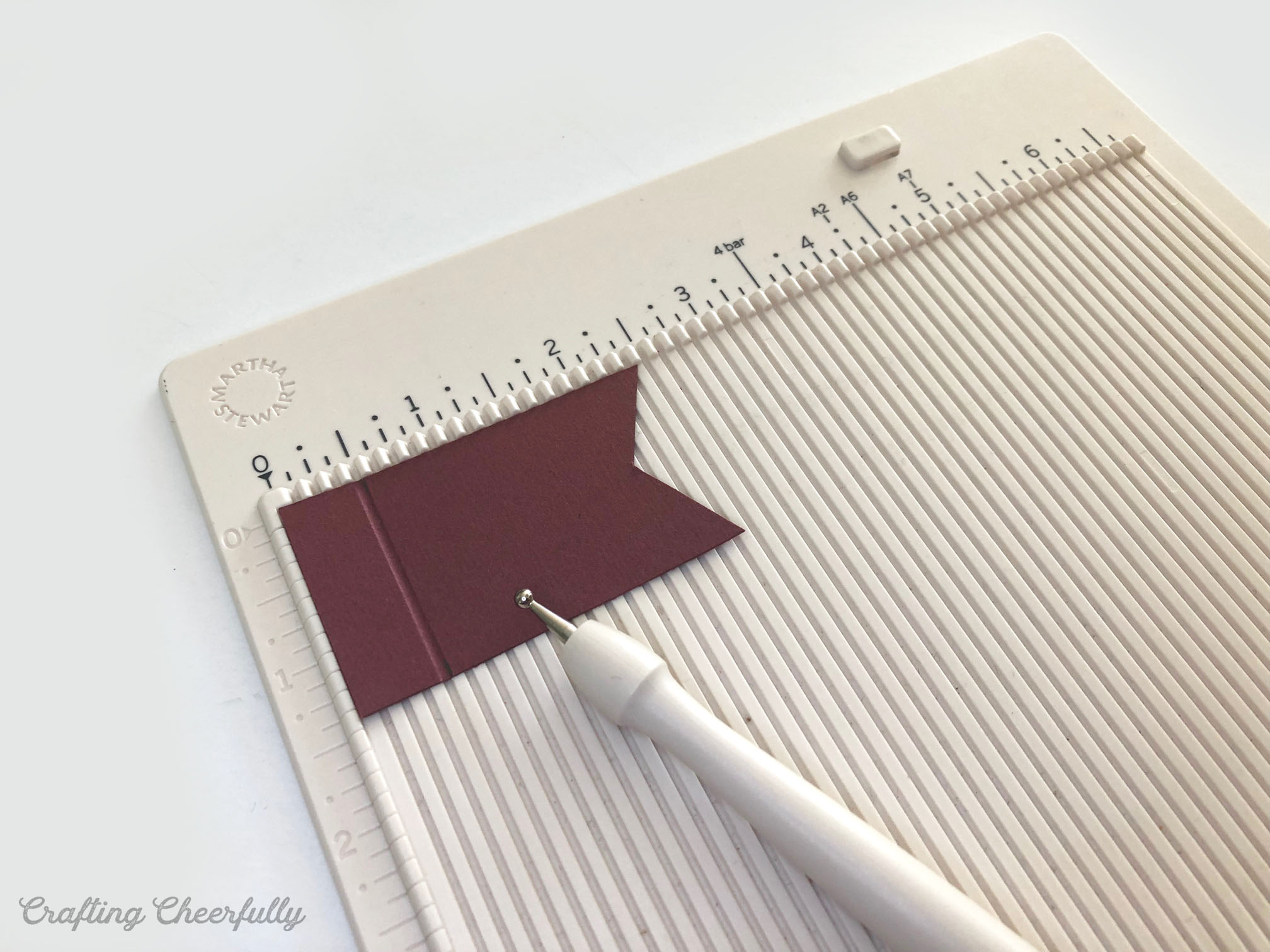 Burgundy banner piece scored on a scoring board.