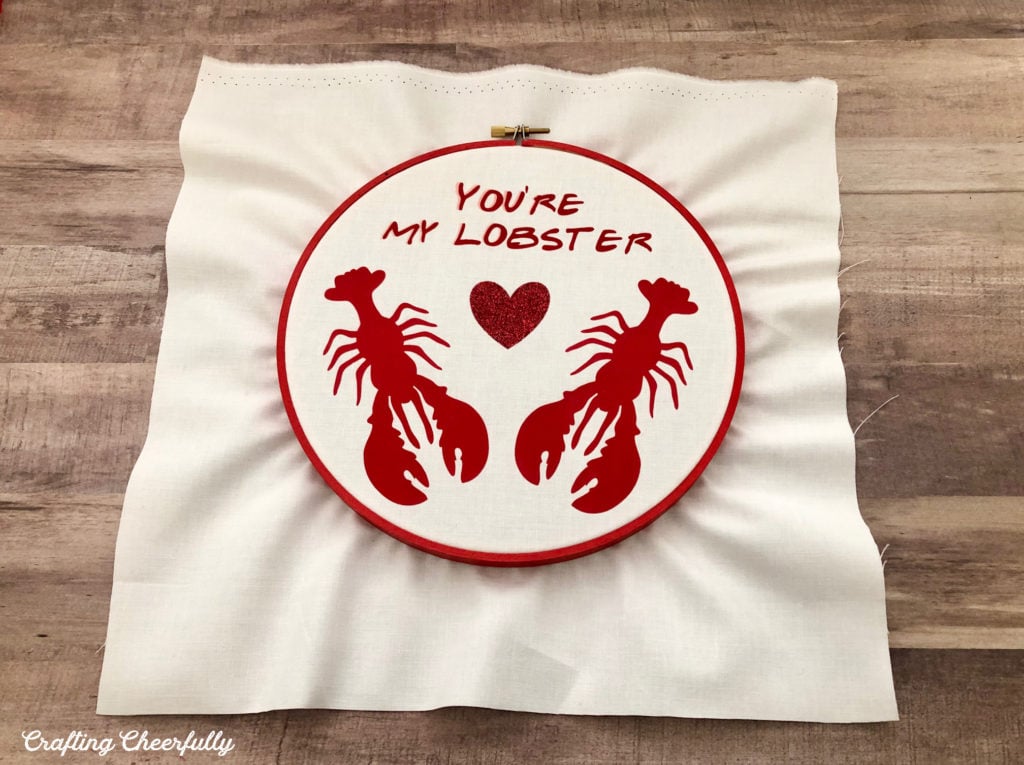 The design is stretched in the wooden embroidery hoop.