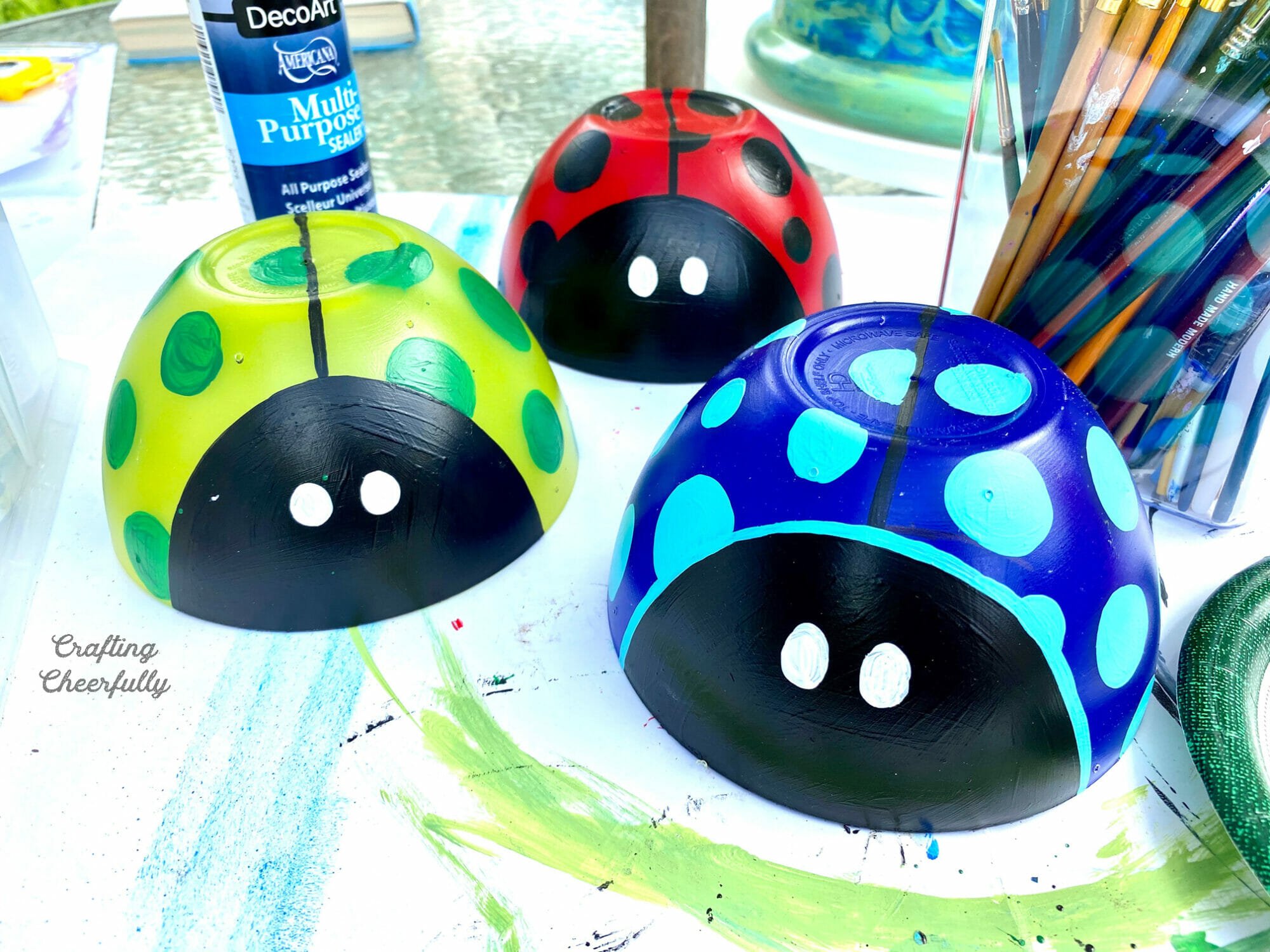Polka dots are added to the ladybugs and white eyes.
